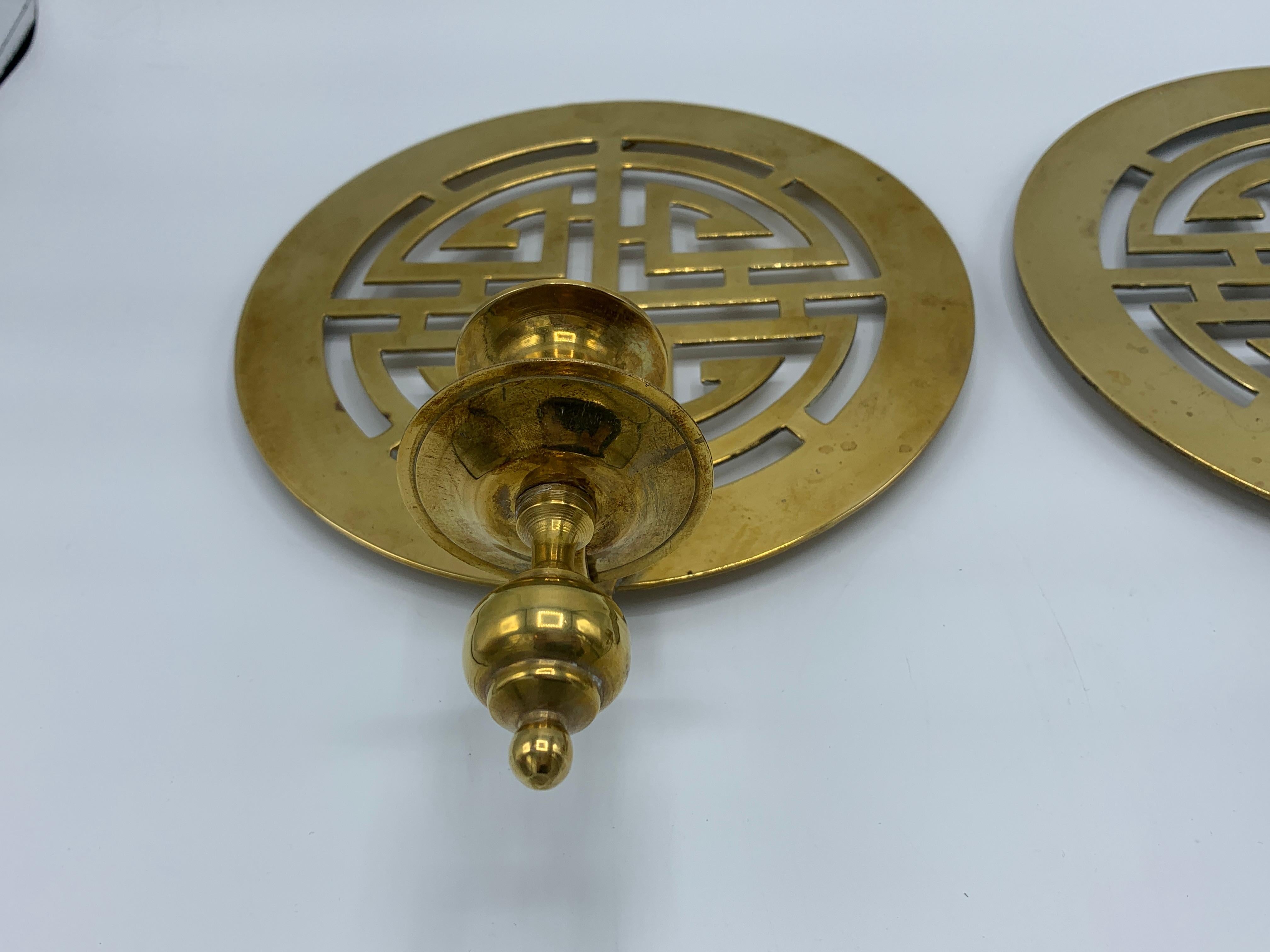 1960s Brass Chinoiserie Symbols Candlestick Wall Sconces, Pair In Good Condition For Sale In Richmond, VA