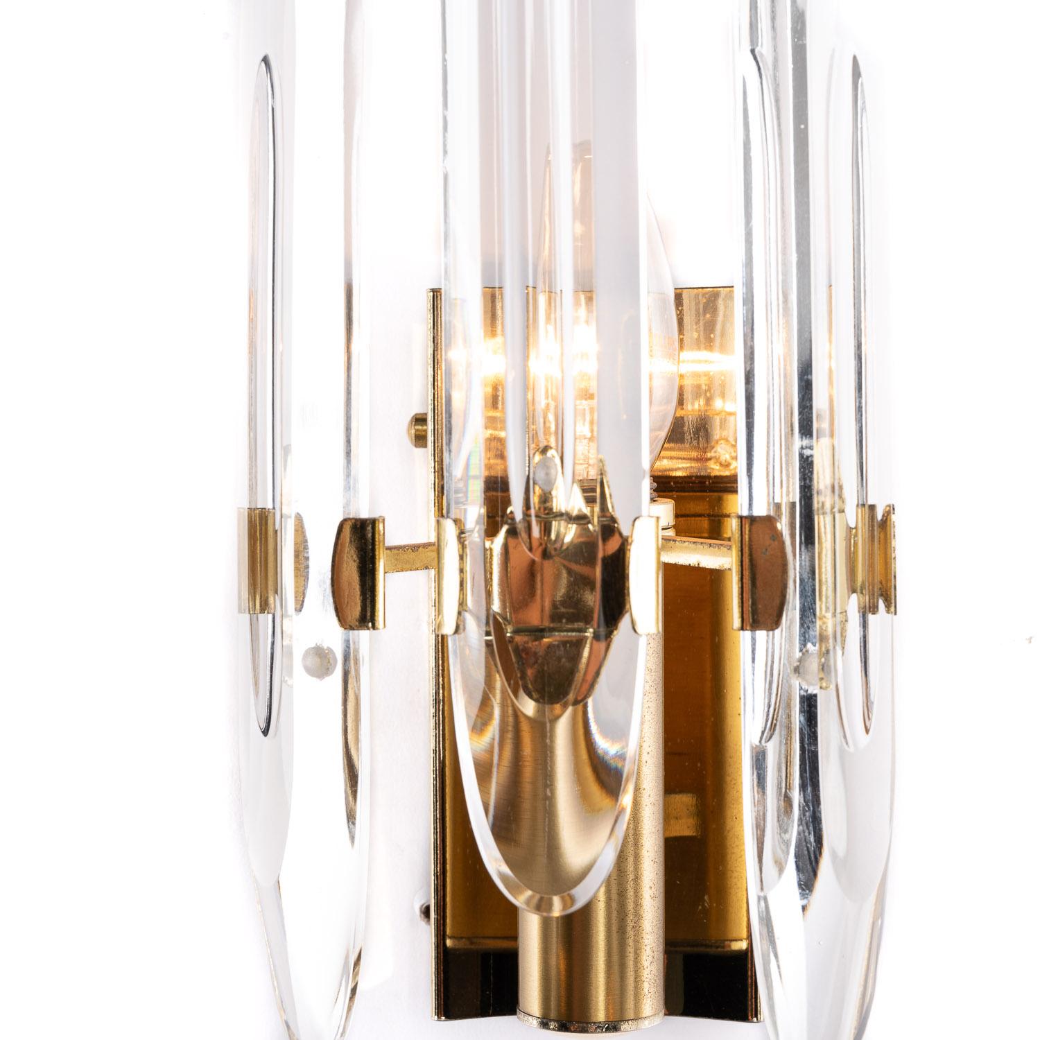 Classic 1970s Italian Gaetano Sciolari design Sconces with characteristic use of crystal glass and brass frame. Some are weathered frames. 

In full working condition and ready to use. Equipped with European wiring, it can support voltage up to