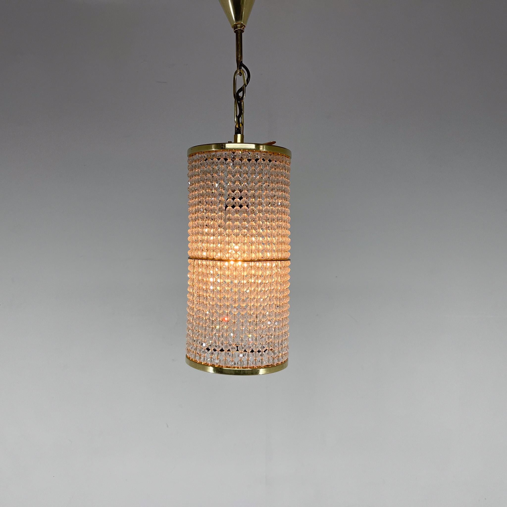 An unusual chandelier from the 1970s from the famous Presiosa glassworks, whose history dates back to the 16th century. Combination of clear glass and brass crystals.