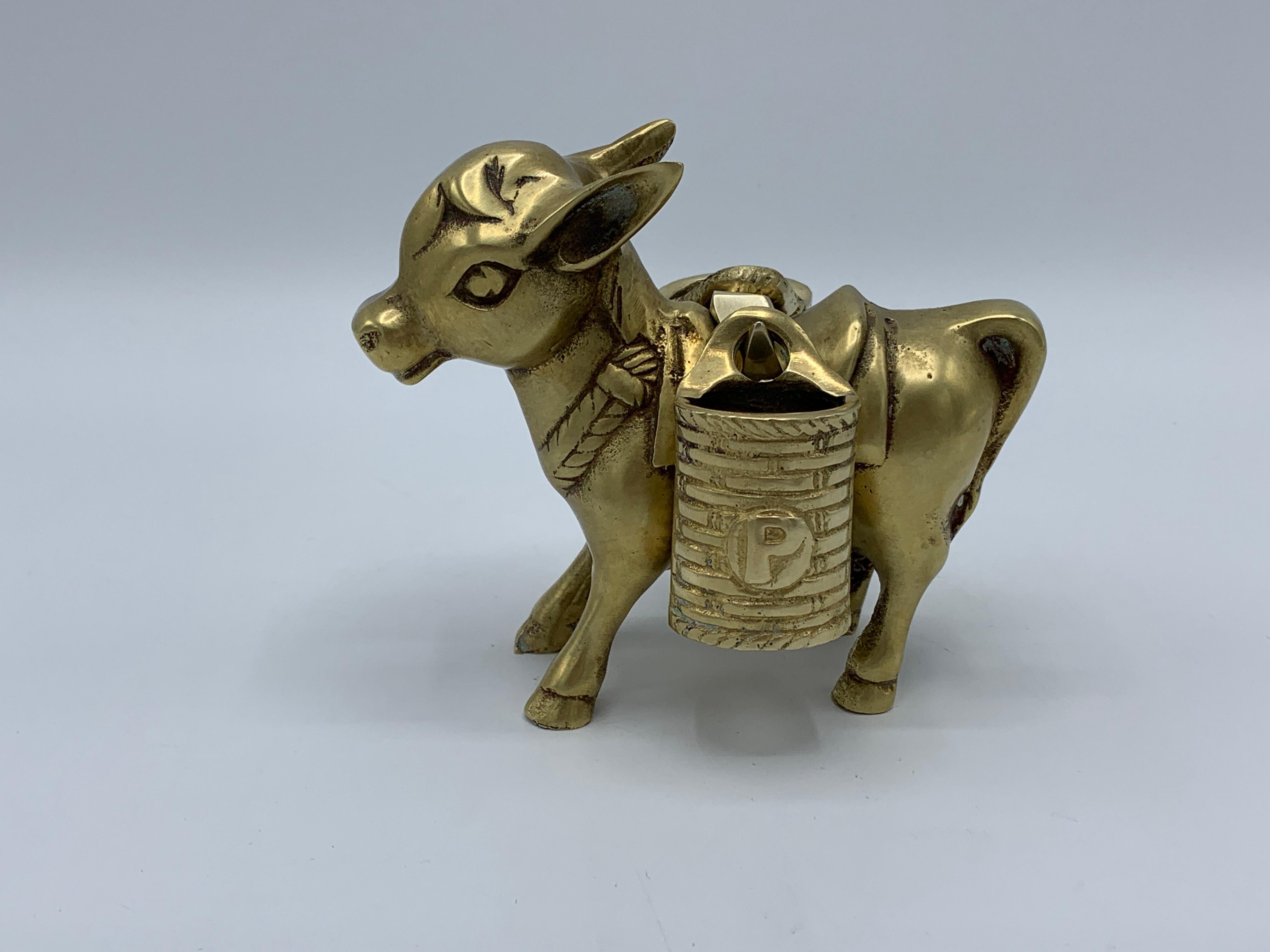 Offered is a unique, 1960s solid-brass salt and pepper shaker set of a mule with saddle bags. Each bag is stamped with an 