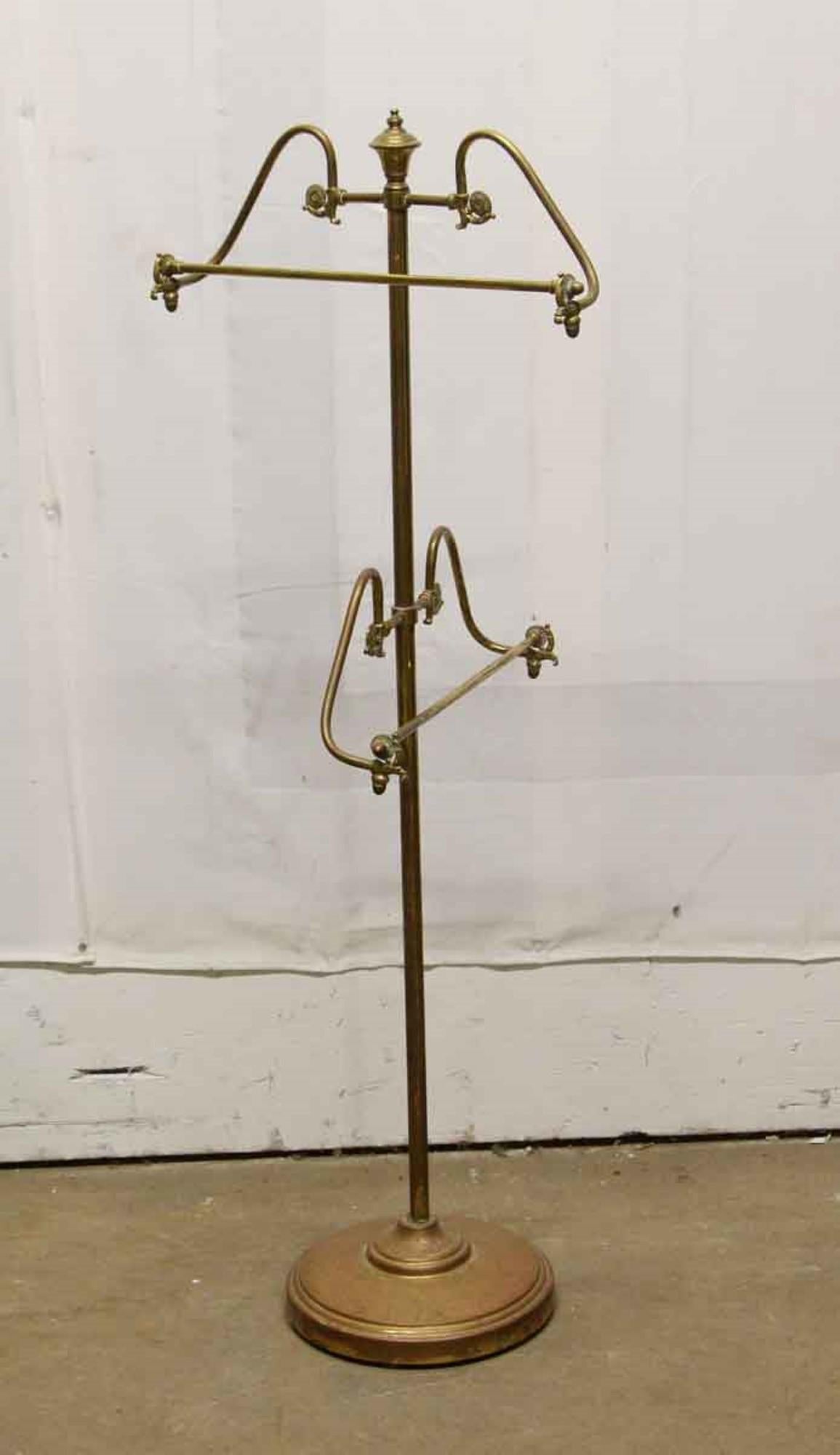 1960s bass valet for men's shirts and suits with decorative cast brass details original patina. Features 2 racks for panrs, suits and shirts. Sometimes called a 