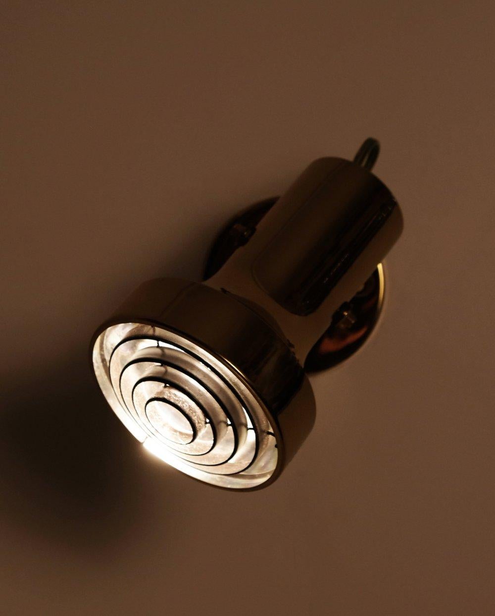1960's Brass Spotlight by Aneta, Växjö, Sweden. Presently a plug in, but could be modified as a hardwire. 40 watts E-26 Edison medium base incandescent bulb recommended or higher if LED/CFL.

Verified E-26 Edison medium base socket and non