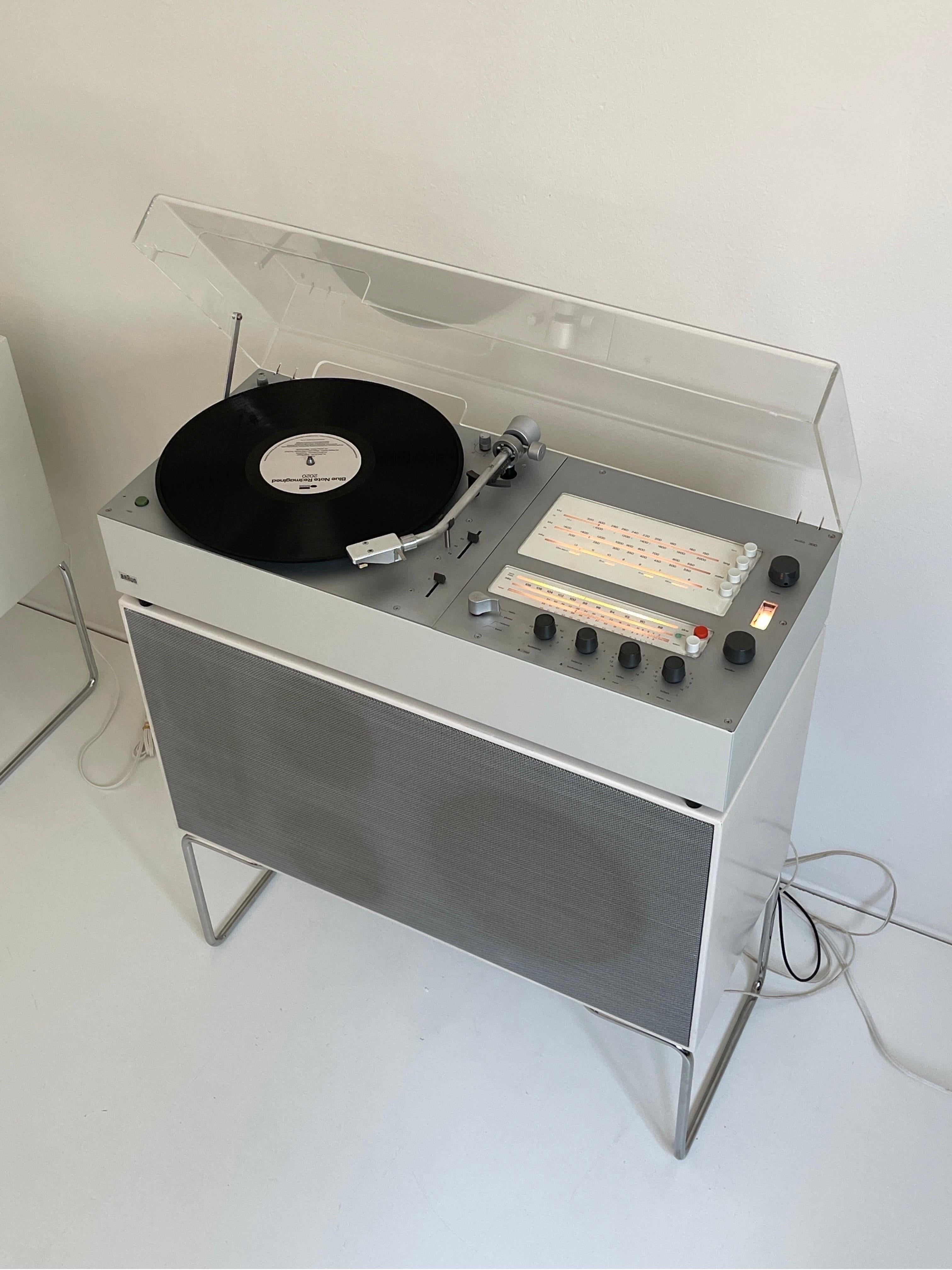 Braun Audio 310 and L50 floor speaker designed by Dieter Rams, 1960's/70's. Equip with AM/FM radio and record player. Fully functional and has been serviced by a technician.