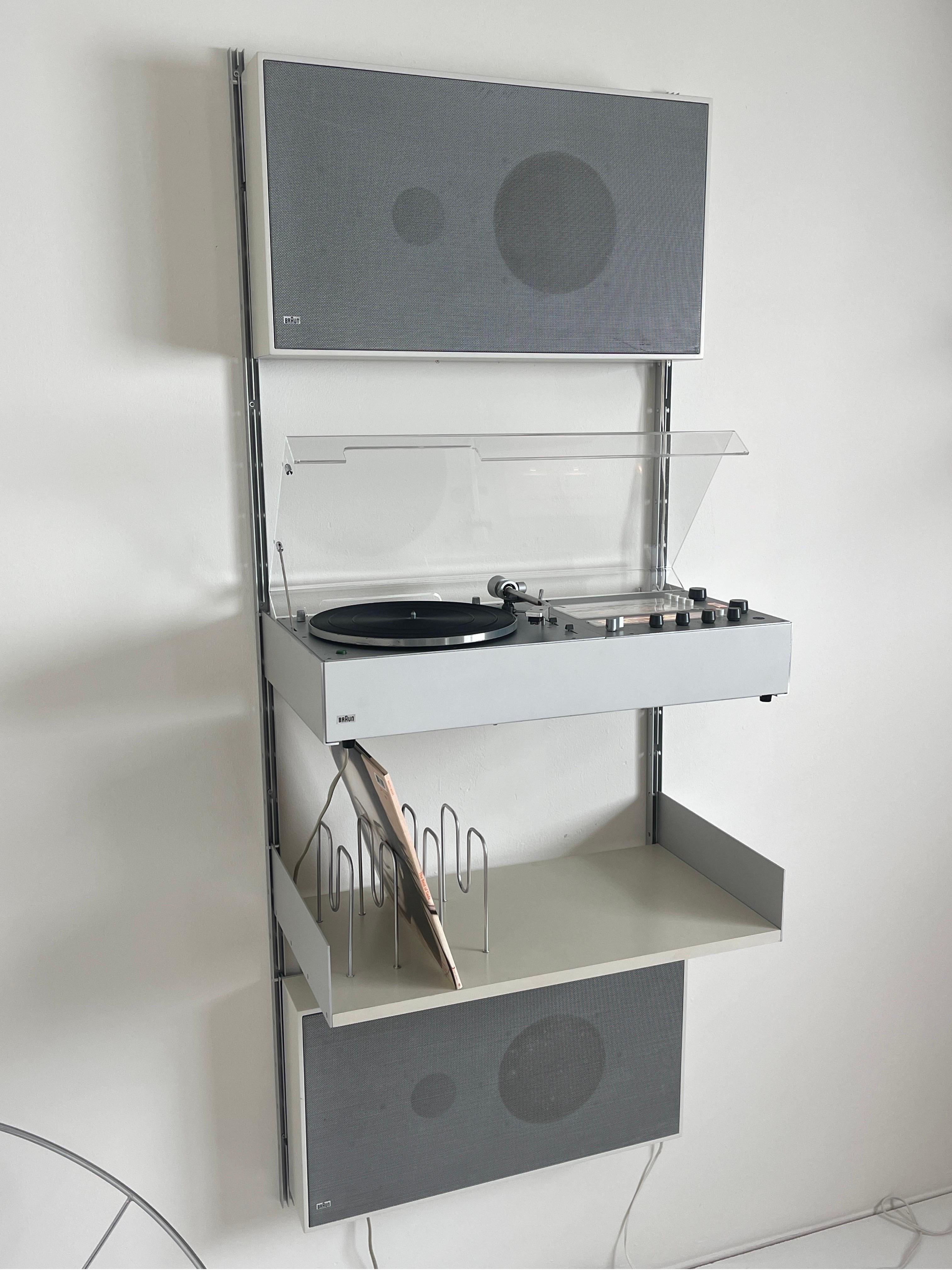 Braun wall mounted audio system designed by Dieter Rams for Braun, 1960's/70's. Equip with Braun Audio 310, L46 wall speakers, and vintage Vitsoe  shelf/e-tracks. Everything included in the picture except the Sade vinyl. Audio 310 is is equip with