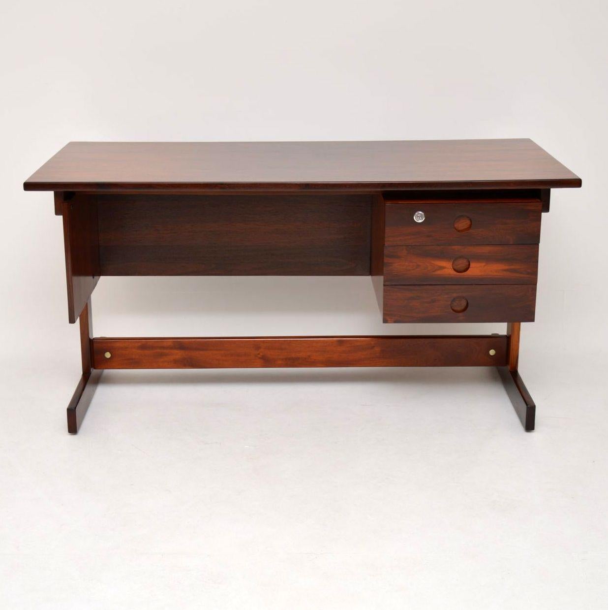 A stunning and extremely rare vintage desk by the important Brazilian designer Sergio Rodriguez, this model is called the Clara desk. It was made in the 1960s in Brazil by the manufacturer OCA. Usually seen with a twin pedestal base, that version is