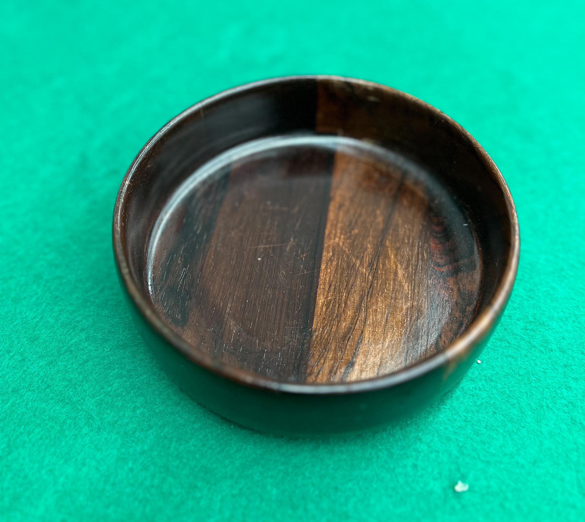 Available today, this Brazilian Mid-Century Modern bowl, designed by Tropic Art, is absolutely stunning! Handcrafted with hard rosewood (also known as jacaranda), this bowl has a deep, dark, and rich tone with a stunning natural wood grain. In