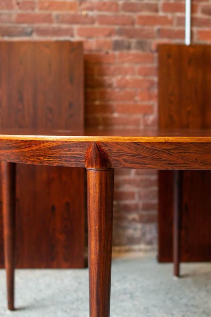 Presenting one of the most elegant rosewood dining tables we have ever found, designed by renowned designer Severin Hansen during the 1960s. With its subtle yet striking design elements that enhance the natural beauty of the wood grain, this table