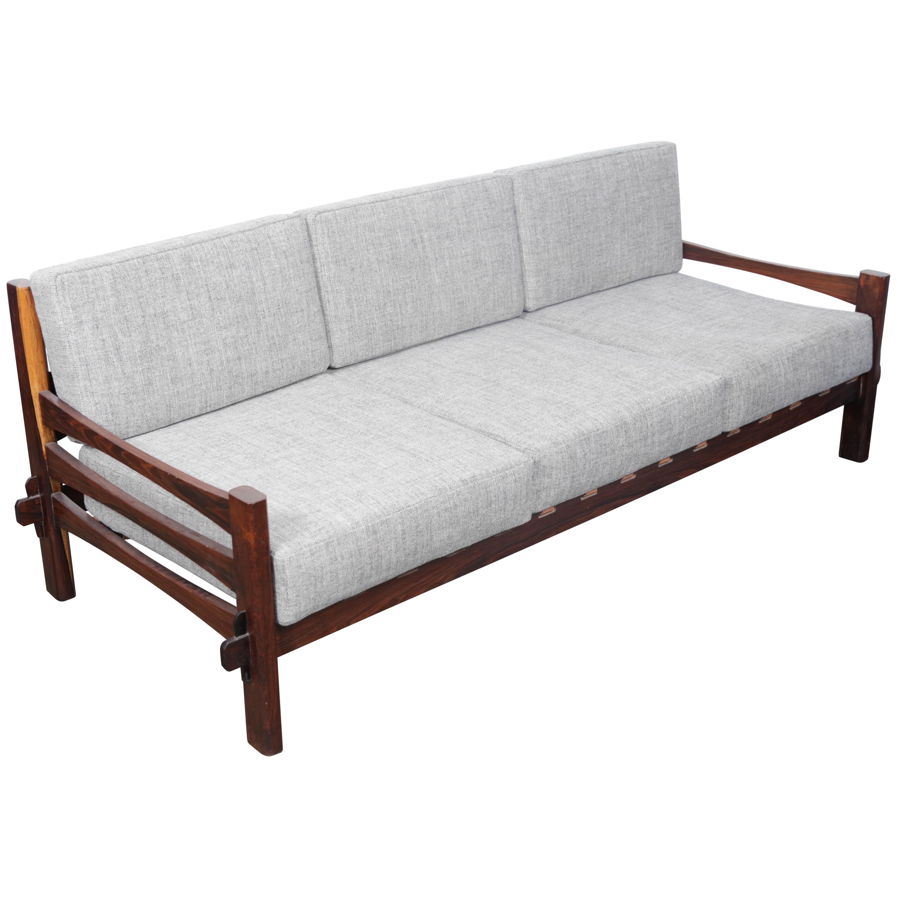1960s Brazilian Solid Framed Rosewood and Leather Strapped Sofa