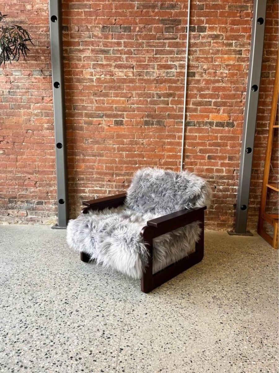 We are thrilled to introduce our latest vintage Brazilian creation: a Model MP185 chair, designed by Percival Lafer in the 1960s. This piece has undergone a complete transformation, restoration, and embellishment with the finest Icelandic sheepskin
