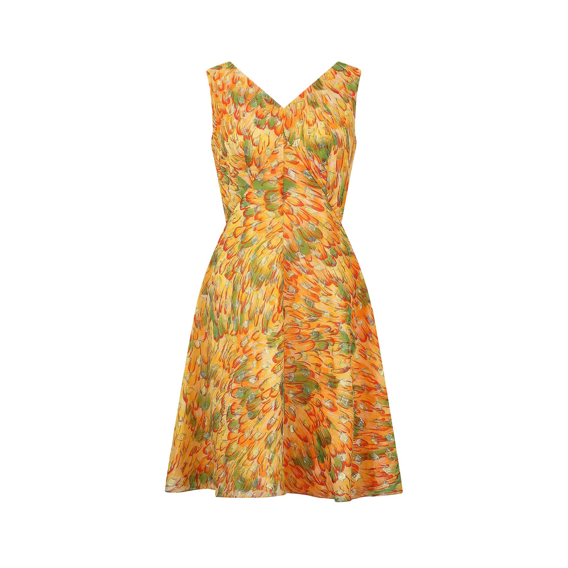 Original 1960s A-line dress by Global in a cheerful colour palette of ochre yellow, orange, red and green, complete with gold lame detail. It has a shallow V-neck to both front and back, with wide shoulder straps and a rear central zip, concealed