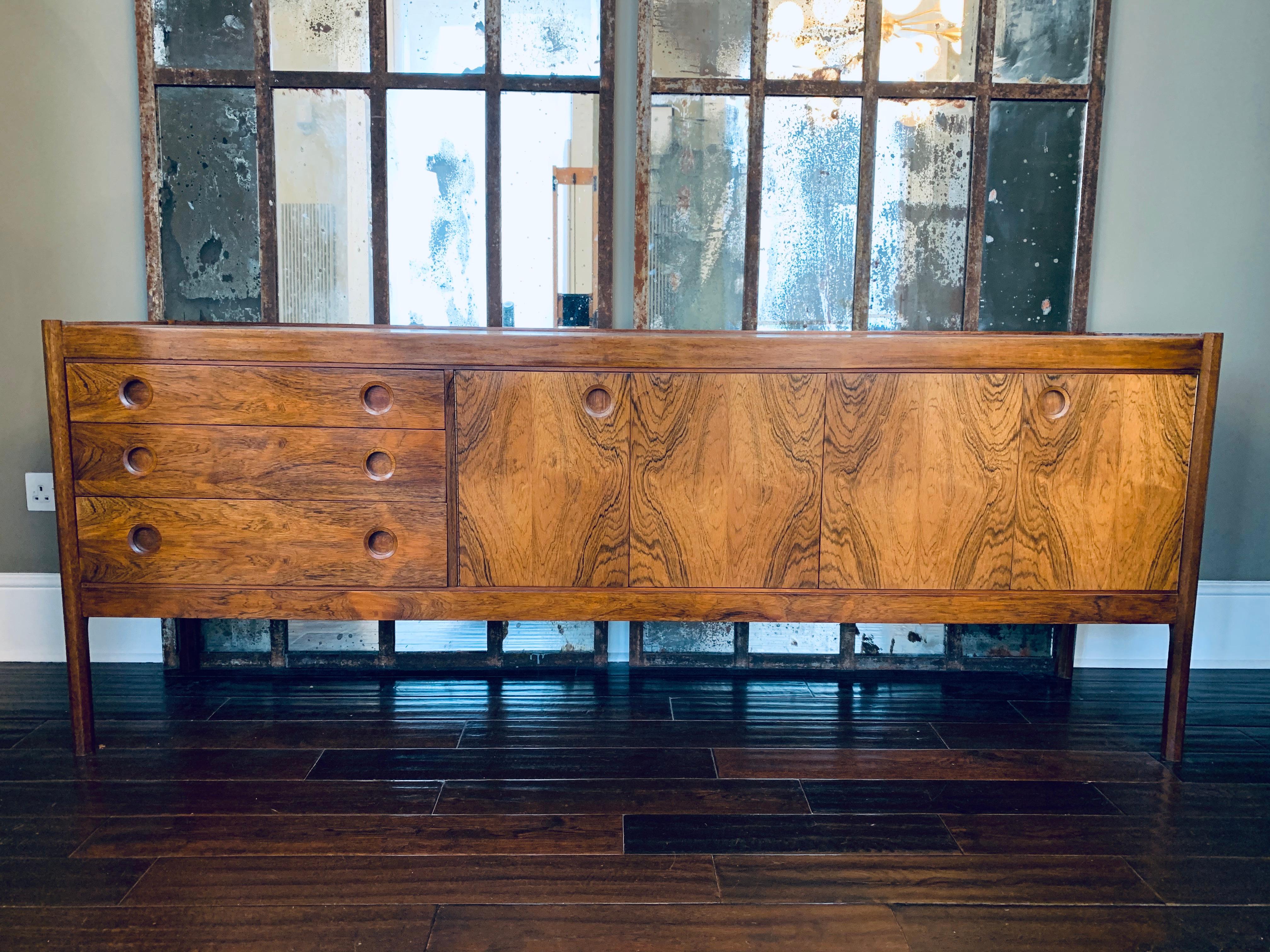 1960s vintage rosewood sideboard, British made in a Danish design, manufactured by Wrighton, who were known as one of the first quality makers of fitted kitchens in the U.K. but also produced a small amount of furniture therefore making this piece