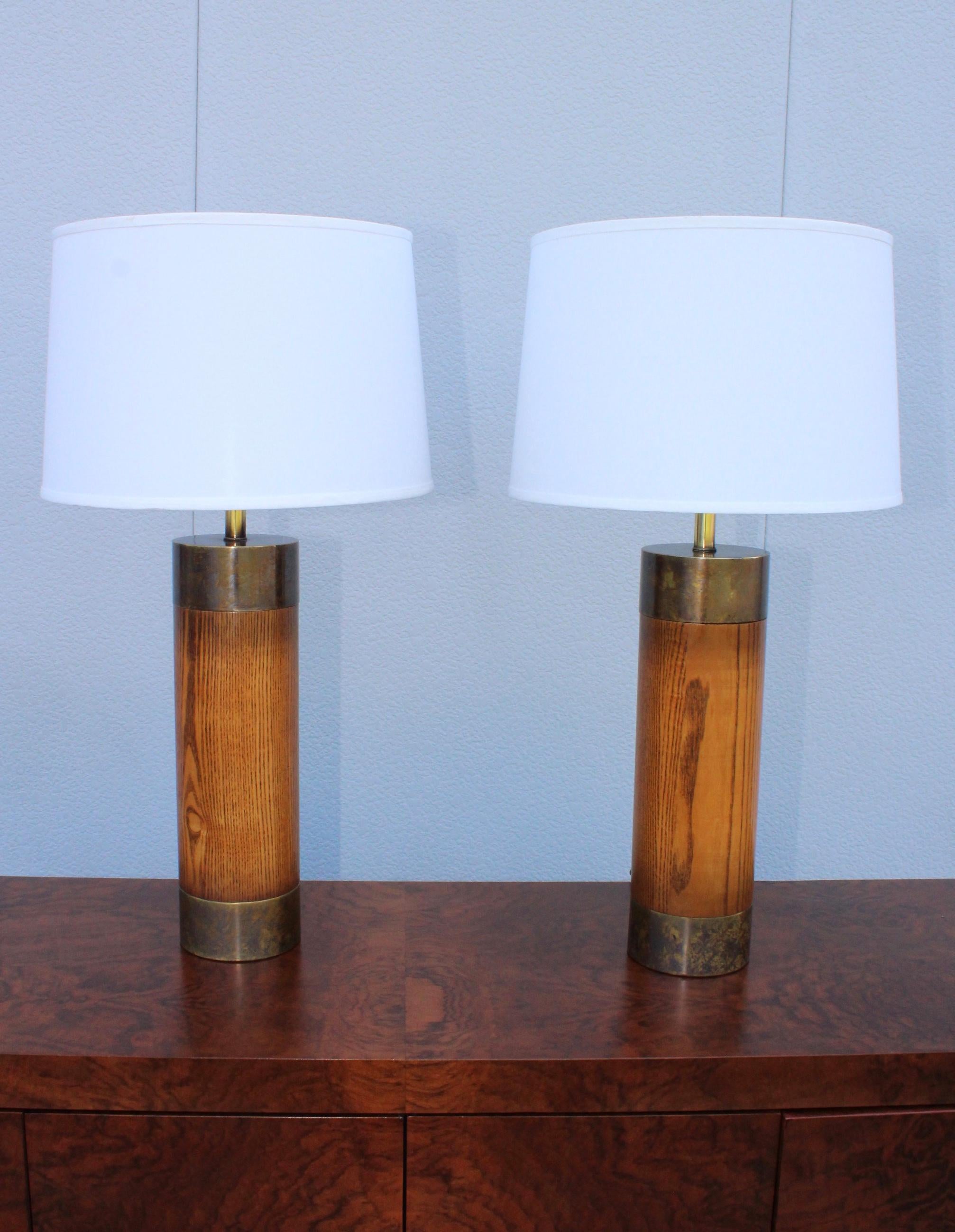 Large pair of 1960s modern patinated bronze and oak table lamps by Westwood.

Measures: Height to light socket 26