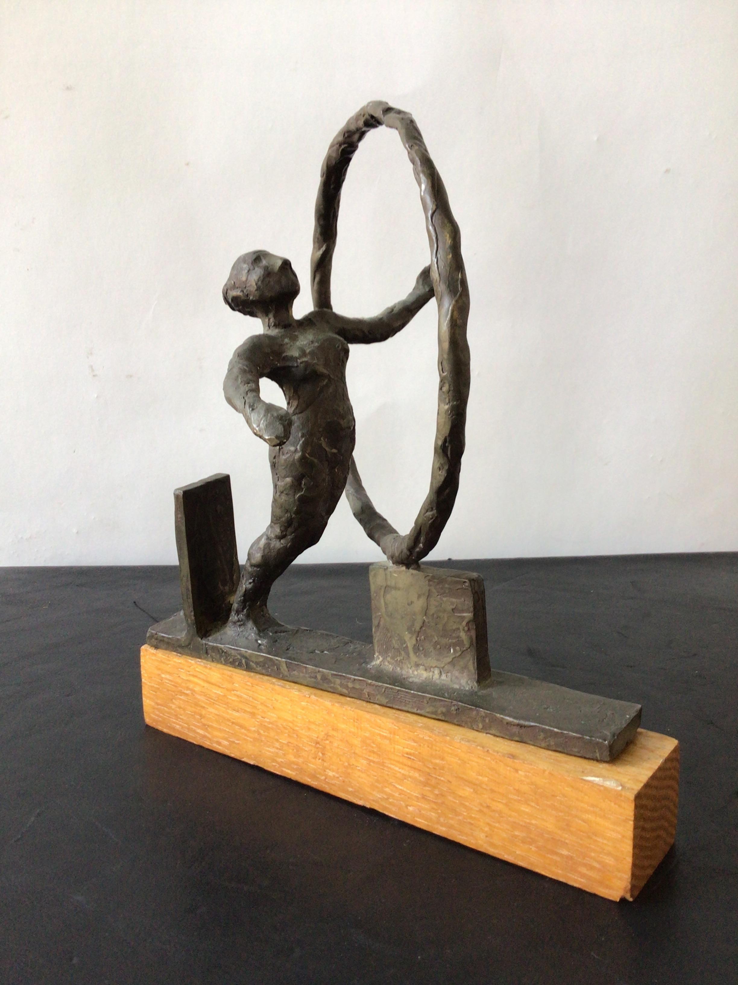 1960s bronze sculpture of nude woman on wood base.