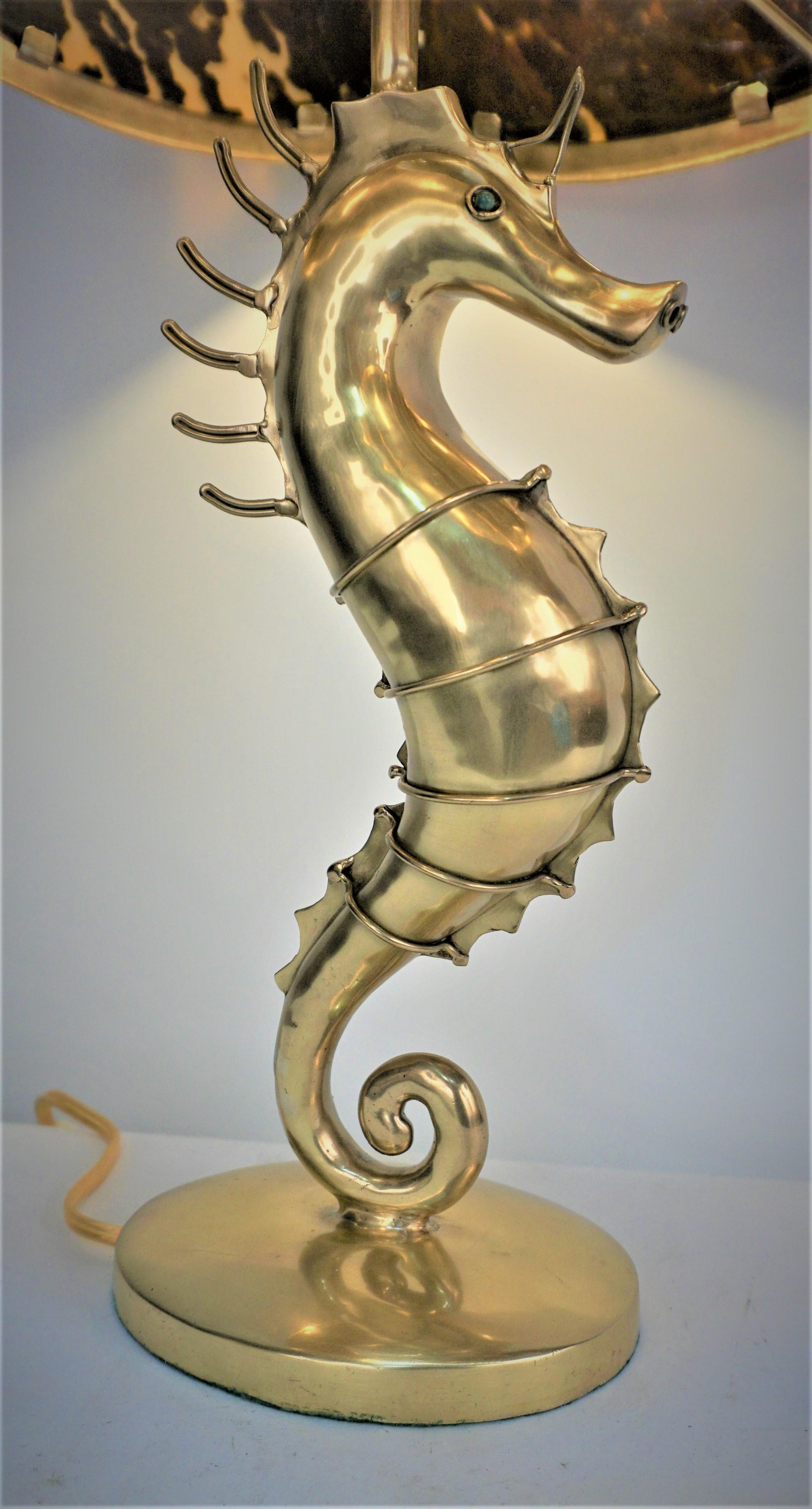 1960s hand crafted bronze seahorse with torques eyes and faux turtle shell shade.
Hexagon lamp shade measurement: 13