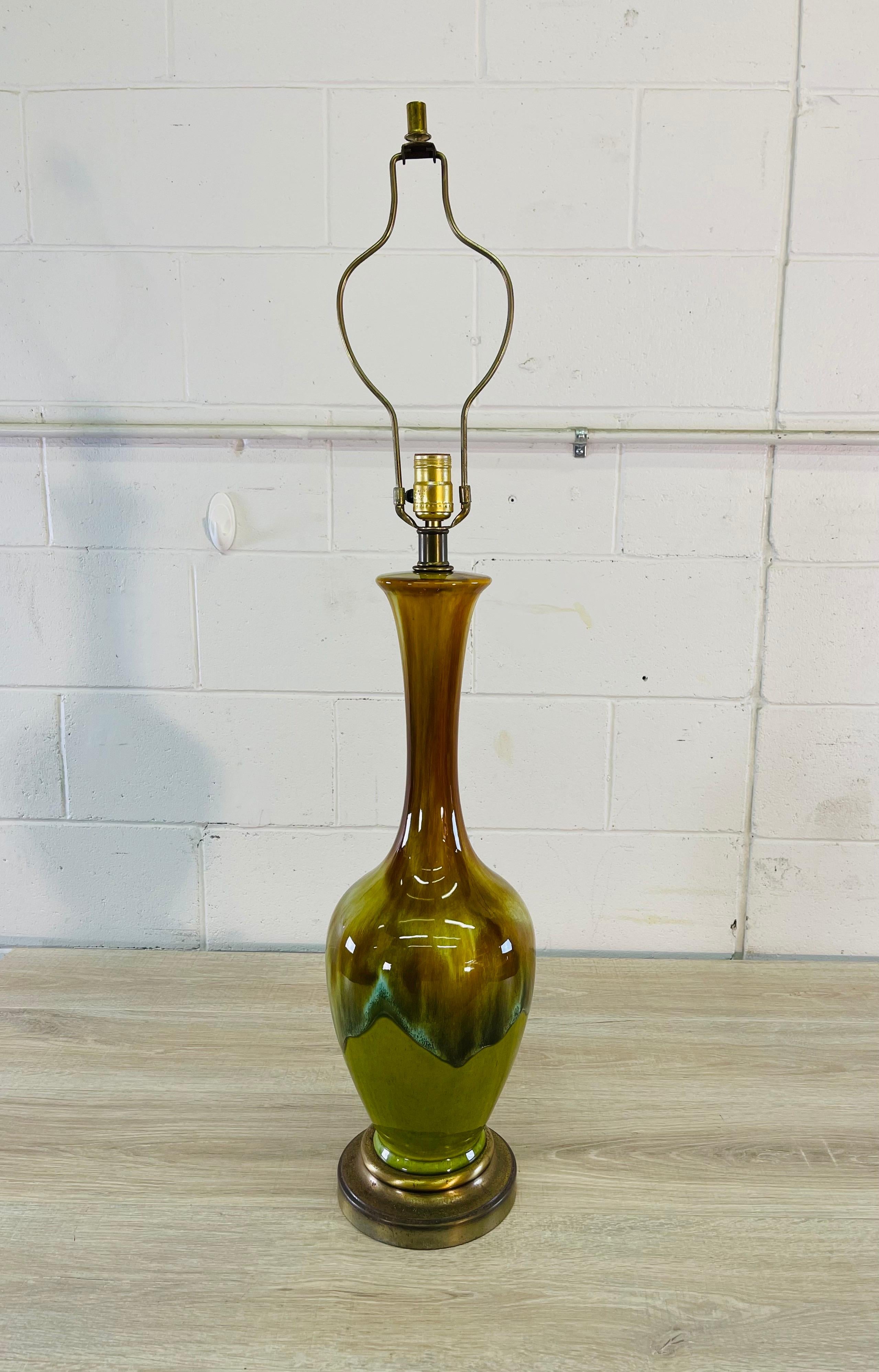 Vintage 1960s brown and green drip glaze ceramic table lamp. The lamp brass metal base. Wired for the US and in working condition. Socket, 28”H. Harp, 6”Dia x 10”H. No marks.