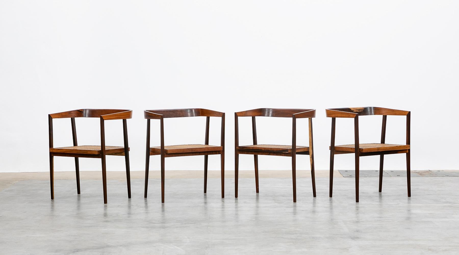 Set of six chairs, Brazilian design, wood and cane, Joaquim Tenreiro, Brazil, 1960.

Stunning set of famous Joaquim Tenreiro chairs. The boldness of the high-quality wood is tempered by the cane back, giving it a light and adaptable feel. 

Joaquim
