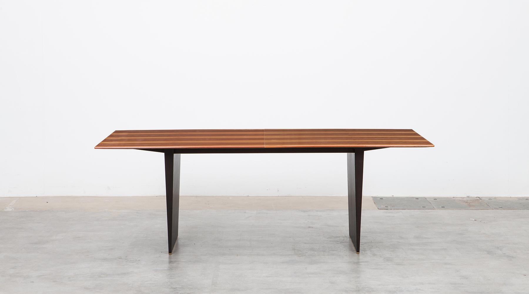 Tawi wooden dining table by Edward Wormley for Dunbar, USA, 1962.

This stunning dining table is designed by American Edward Wormley and comes with a wooden Tawi top which is composed in three leaves, so the table is extendable from 213 to 303 cm.