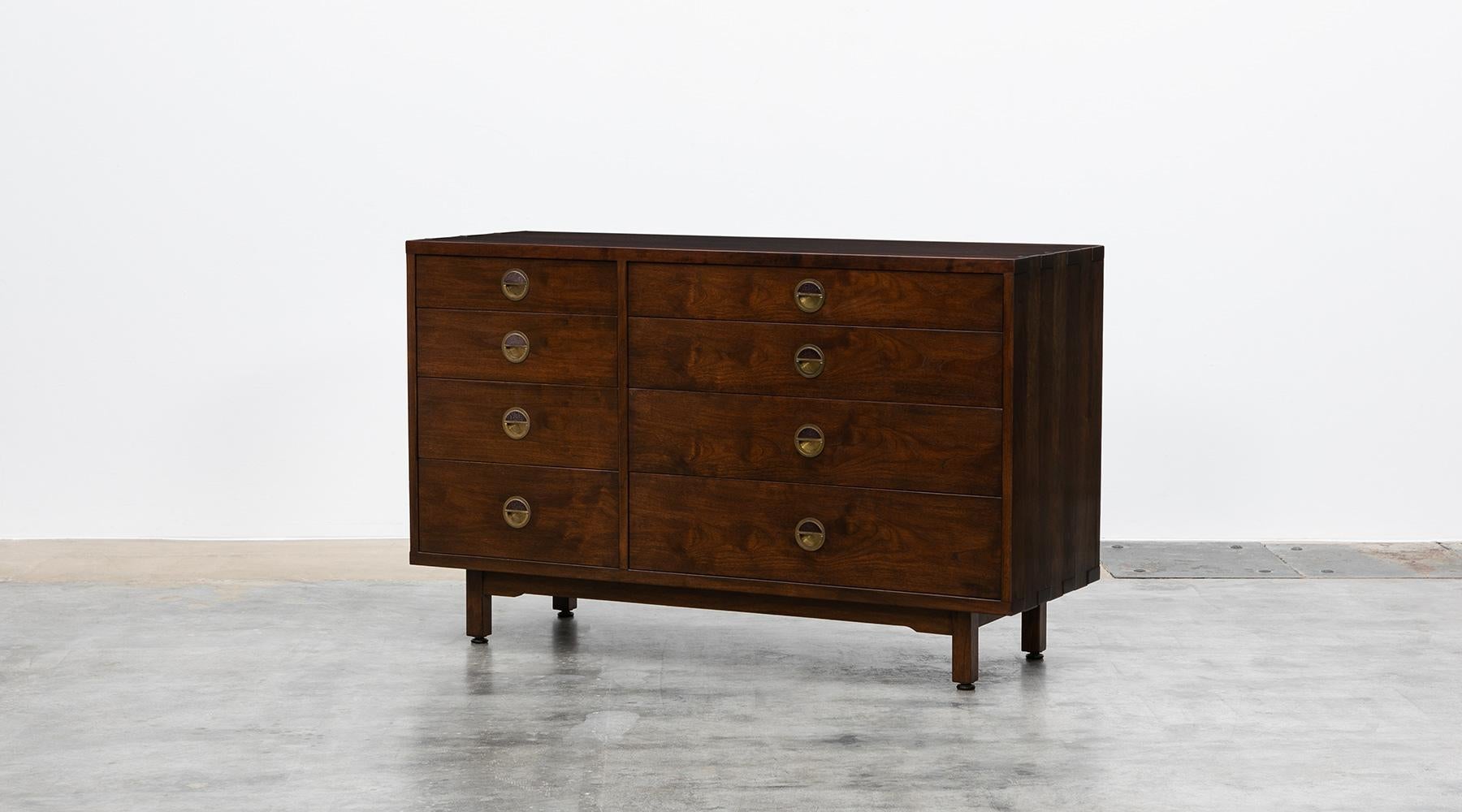 Sideboard in walnut, brass and rosewood details by Edward Wormley, USA, 1960.

Fantastically simple and beautiful Edward Wormley cabinet. The marvelous walnut wood is matching graceful with brass handles and rosewood details. Manufactured by
