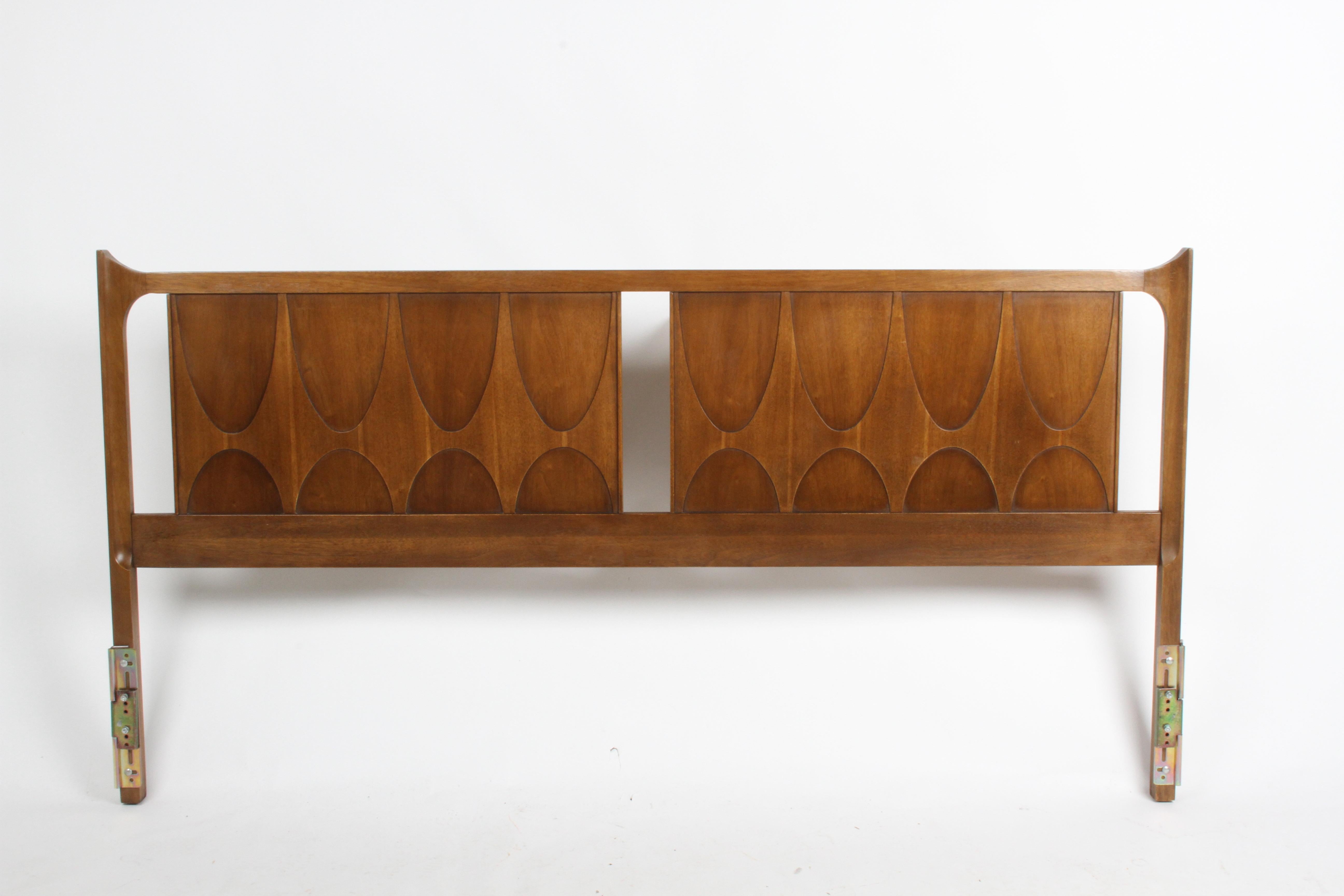 Mid-Century Modern kingsize headboard from the 1960's Broyhill Brasilia collection. Walnut frame is in all original, unrestored condition, only a few dings, see photo, otherwise a prime example. Includes original mounting hardware. Lablel, model