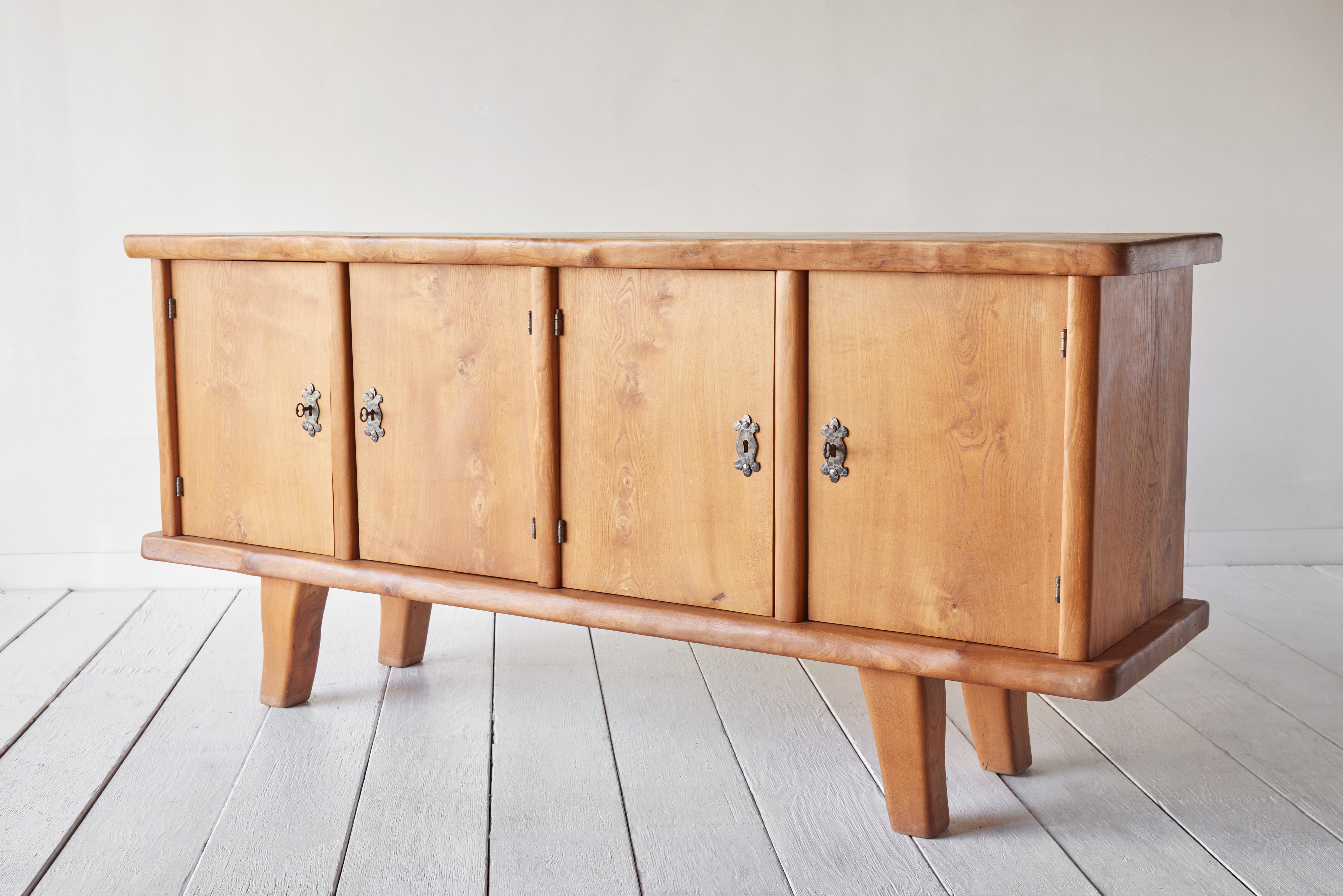 Solid oak credenza circa 1960 with hand forged iron hardware.
     