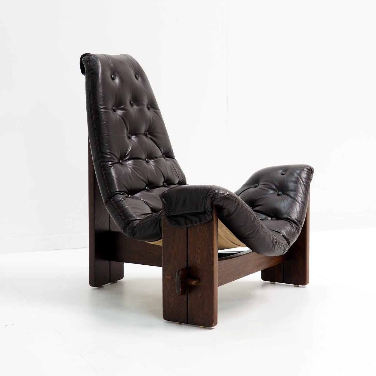 Very special lounge- or sling chair of most probably Brazilian origin.

This chair, with its brutalist and beautiful jungle look, is handmade using only natural materials and earthy colours. No screws used. The canvas and dark brown leather is
