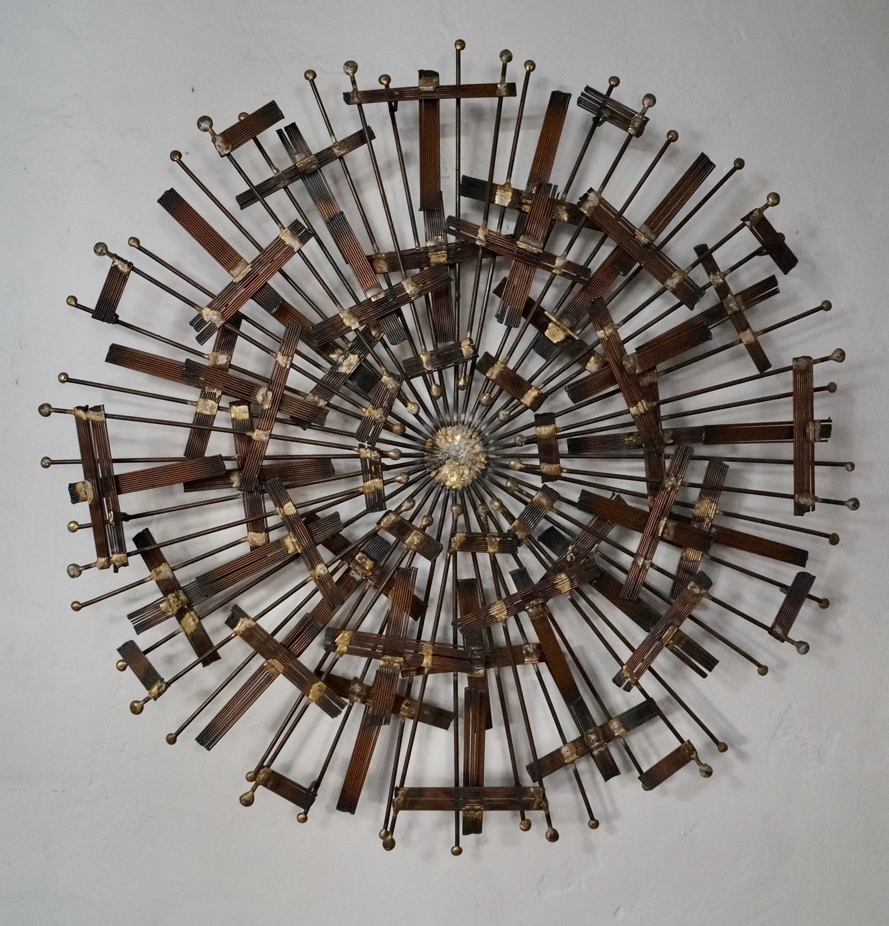 We have this stunning original Brutalist Midcentury Modern designer wall art piece for sale. It's an original piece of brutalist wall art, and dates back to the 1960's. It's rare, and truly a gem! It's a sunburst, and is made of metal with solid