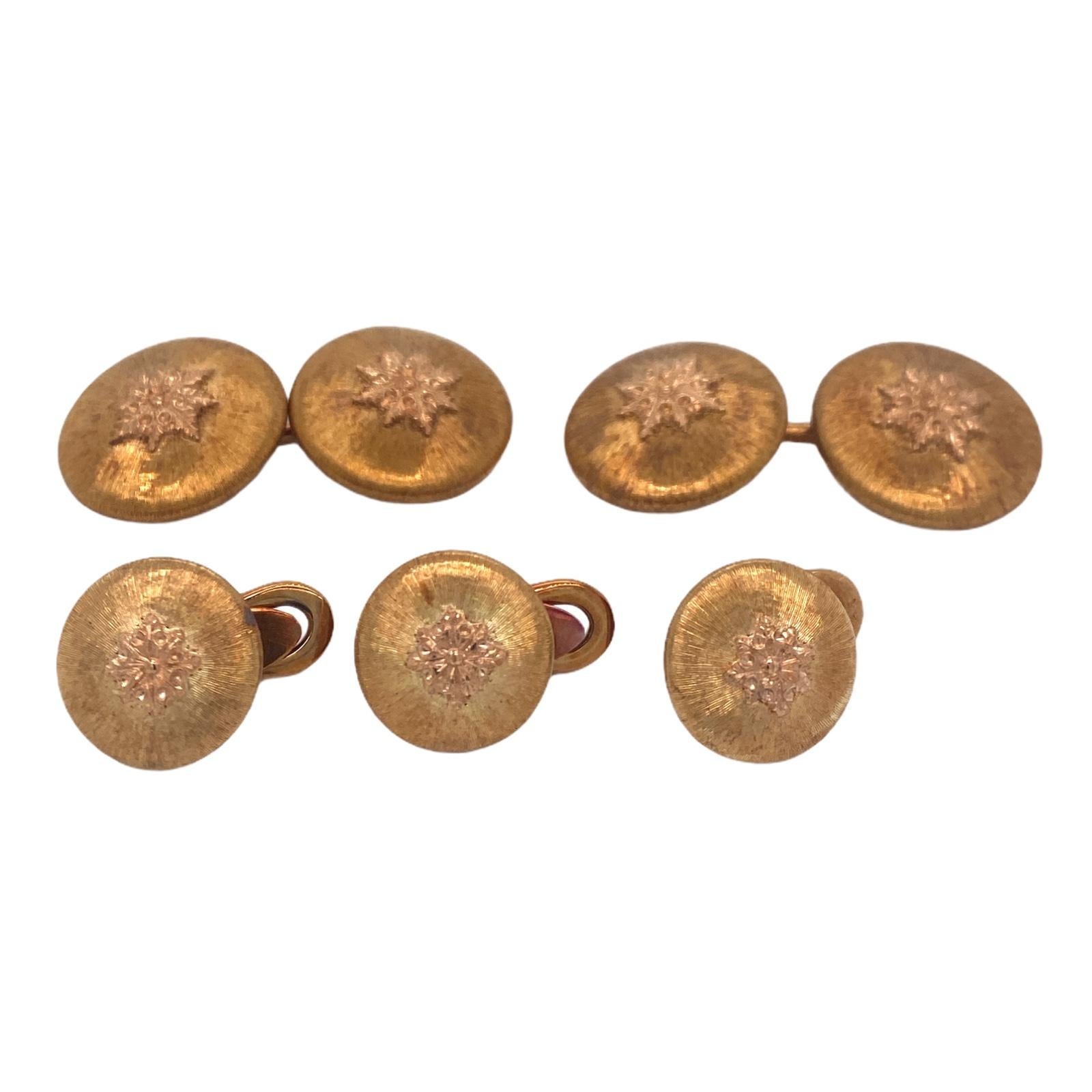 Buccellati cufflinks and stud set fashioned in 18 karat yellow gold. The 1960's set comes in its original box. The cufflinks measure 16.3mm in diameter, and the studs measure 12mm in diameter. 