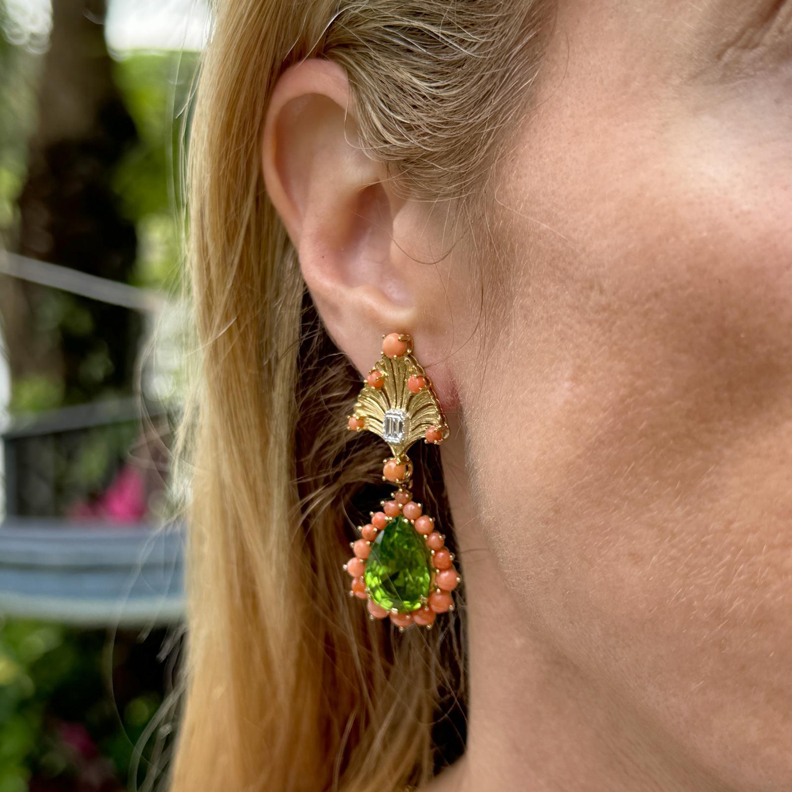 These rare Buccellati peridot, coral, and diamond vintage drop earrings are a stunning example of the brand's distinctive style and meticulous craftsmanship. Each earring, crafted in 18 karat yellow gold, is a miniature work of art, showcasing a