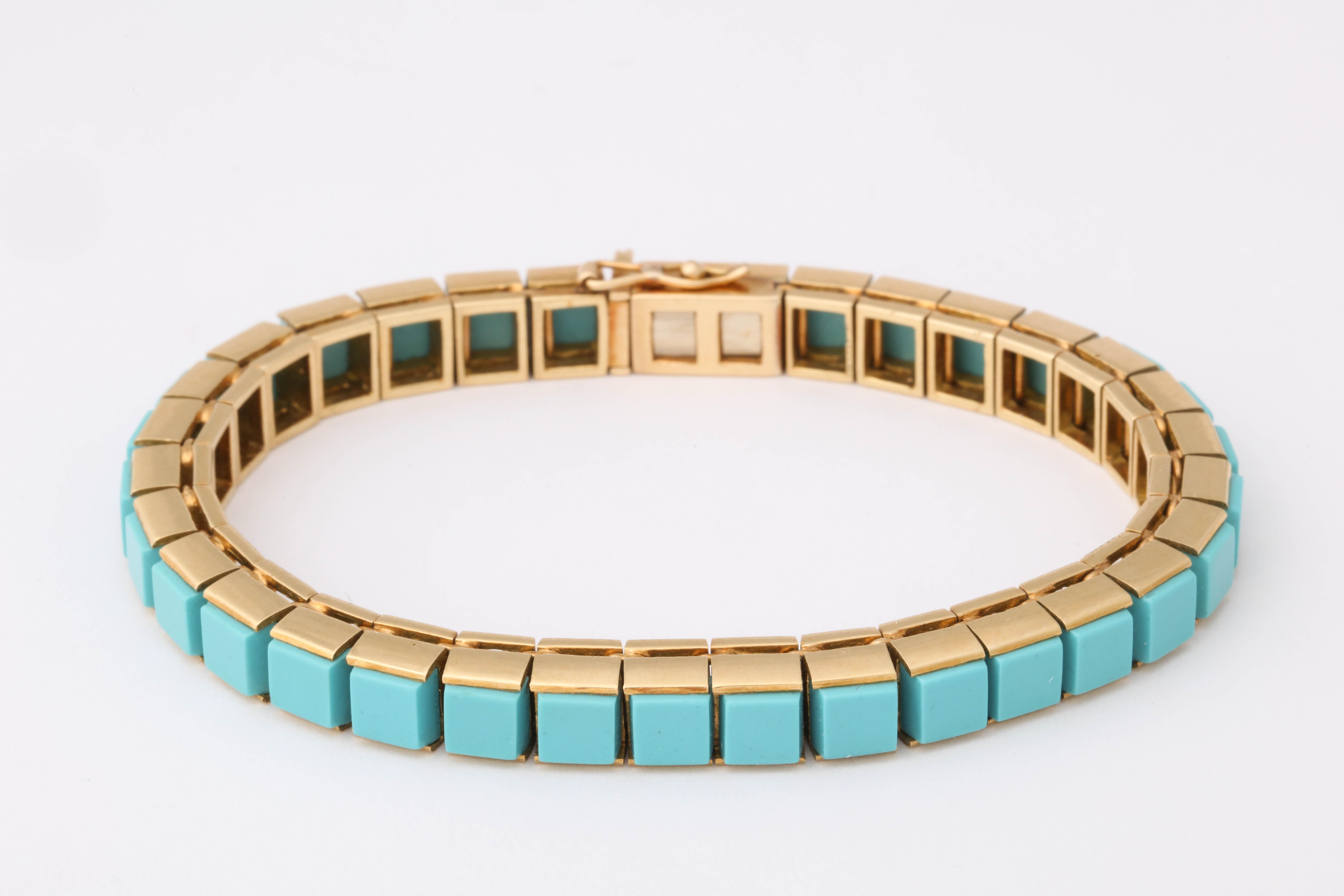 Dating to c.1965, this turquoise bracelet consists of 33 stones cut flat on the top. A beautiful line bracelet set in 18K yellow gold. 