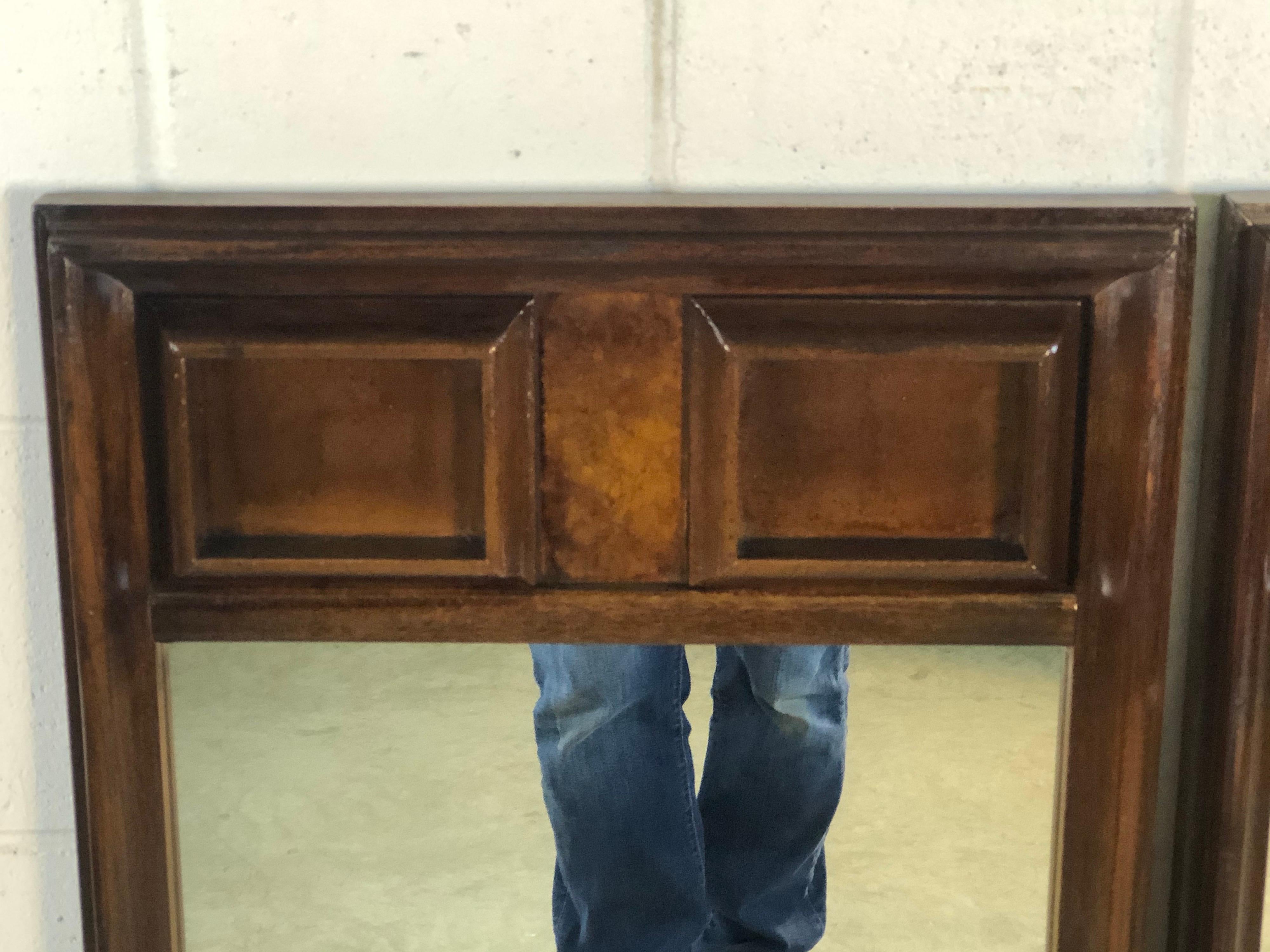 1960s pair of burlwood style block designed wall mirrors. Both mirrors are in refinished condition. The mirror frame is ash wood. Hardware is not included. No marks.