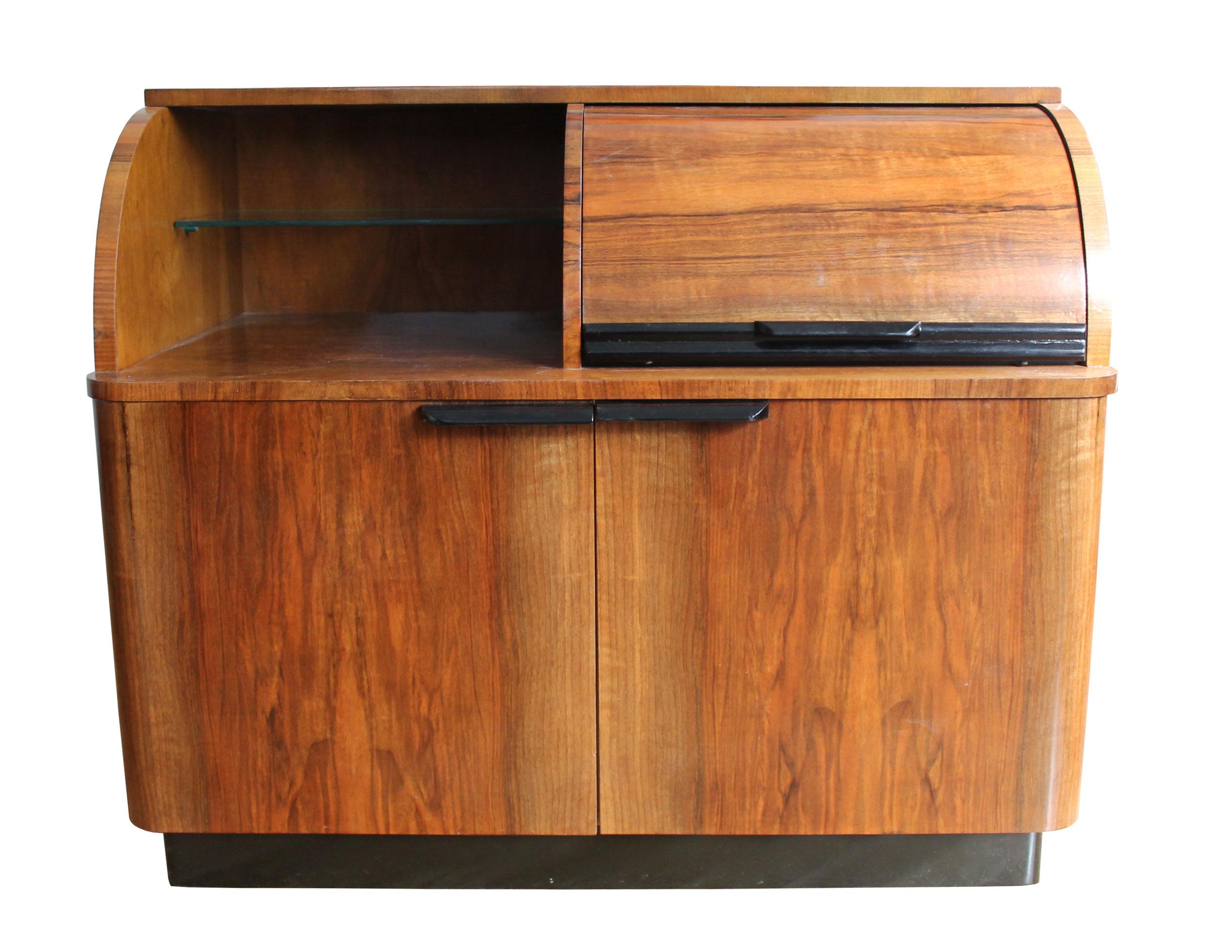 This cabinet was produced in Czechoslovakia in the 1960’s. Originally it was designed as a music cabinet to house a record player within the top right section of the piece, with records stored in the bottom left cupboard and magazines etc in the