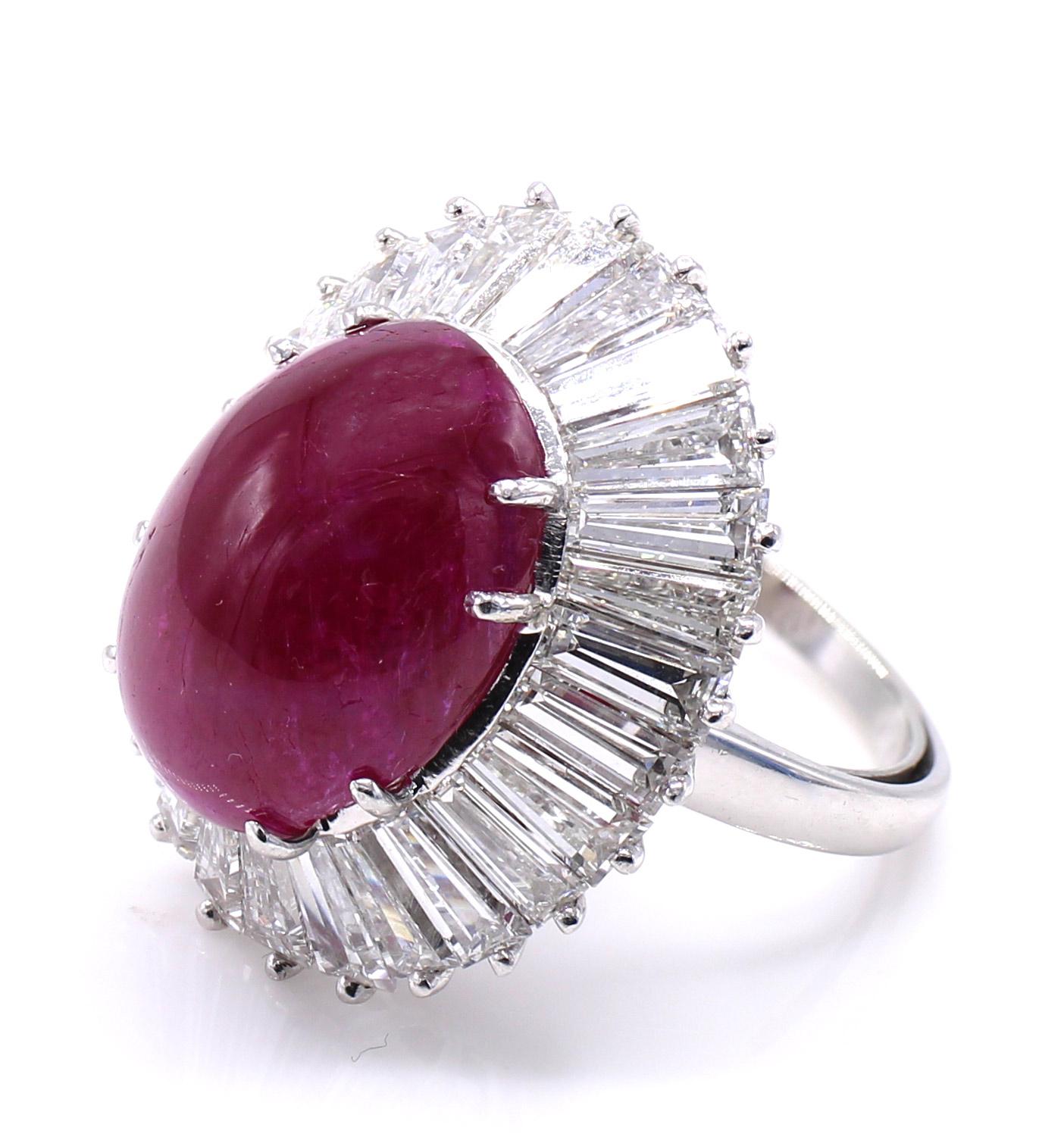 The centerpiece of this 1960s impressive ballerina ring is a cabochon ruby weighing 17.21 carats. The ruby is accompanied by a report from the GIA stating that the origin is Vietnam and that it is natural with no heat treatment. Embellishing the