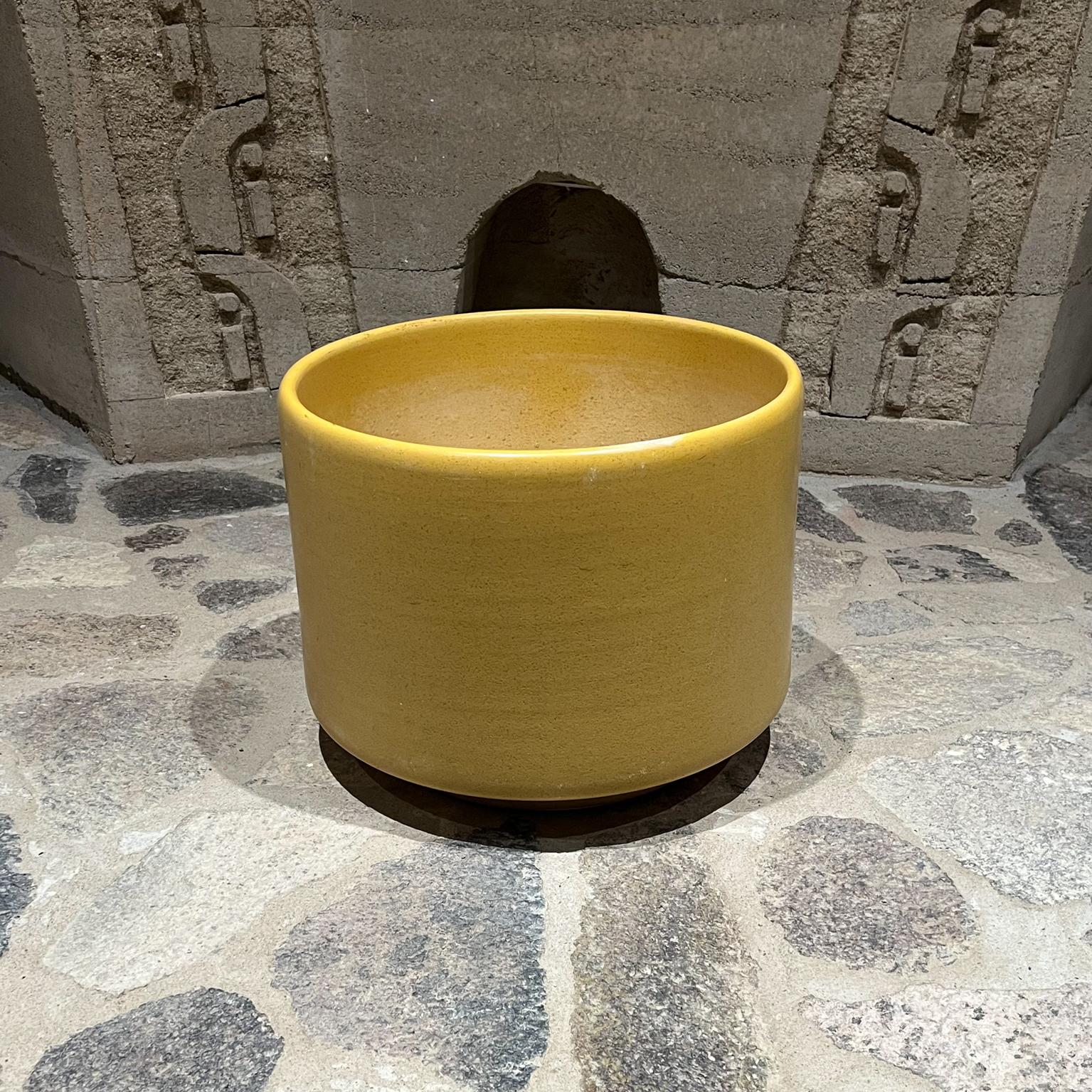 1960s Modern yellow mid century architectural planter pot.
Measures: 13 tall x 17 diameter.
Planter Pot garden patio home.
Style of Gainey Pottery. Signed underneath with maker's label. Difficult to read.
Original preowned unrestored vintage