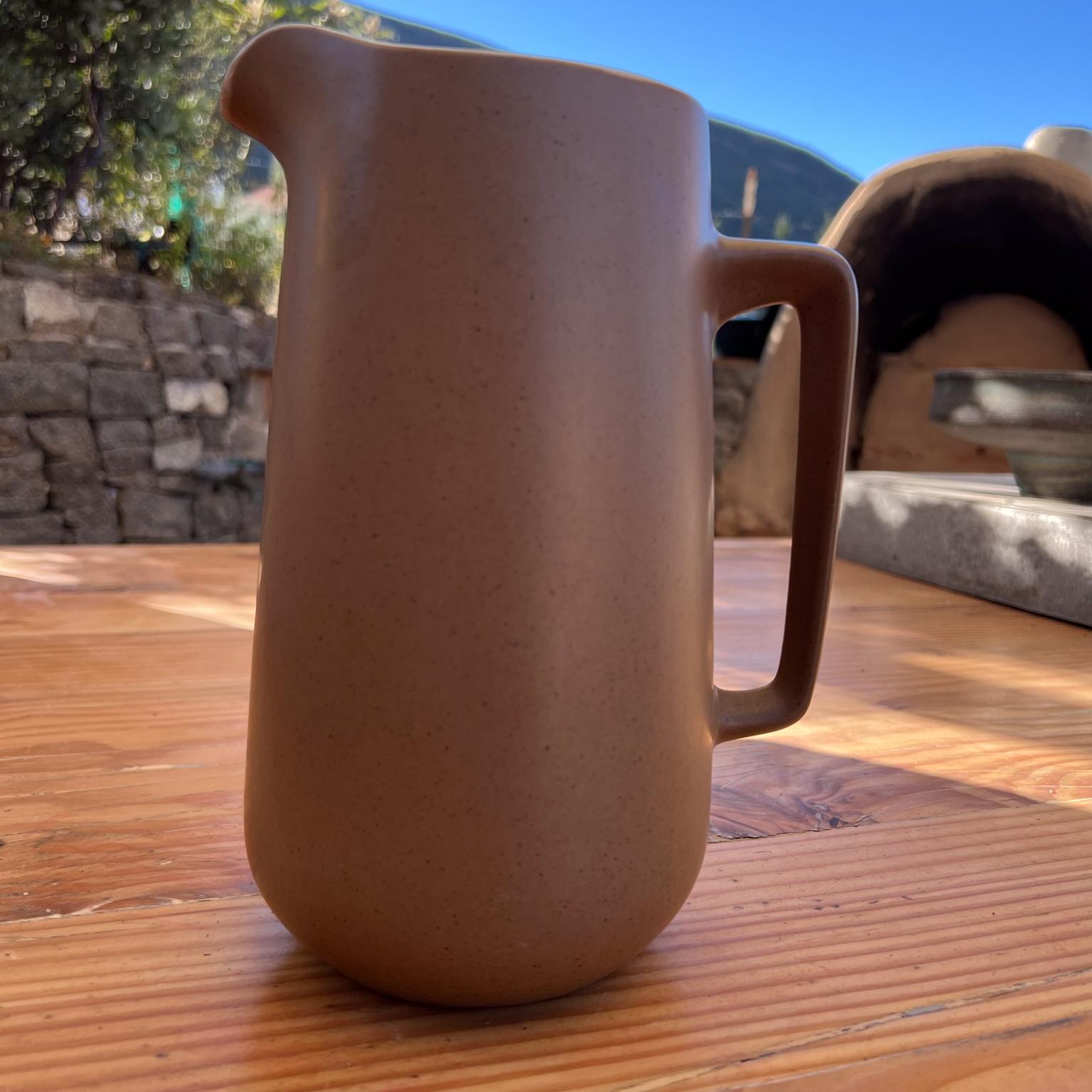 California Ceramic Stoneware Pottery Pitcher Two-Tone Metlox
Manhattan Beach Ca
Taupe and creme
approximately 9.5 inches 
Preowned original vintage condition.
Refer to images.

