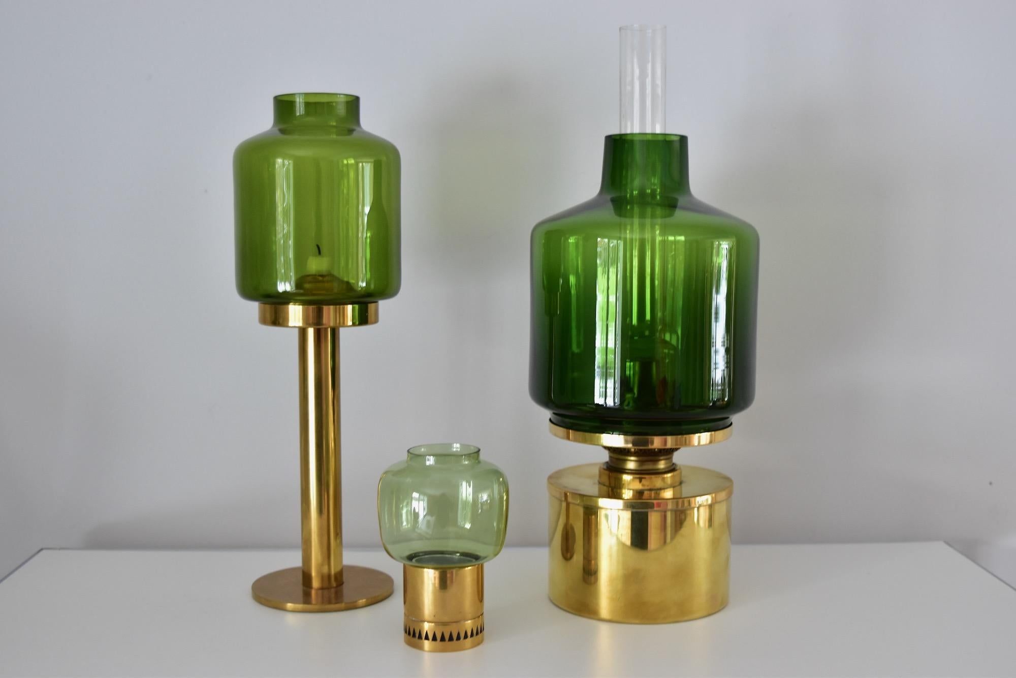 Beautiful candlesticks by Hans-Agne Jakobsson.
Measurements: Diameter 8cm, height 12cm
Green glass and brass base.
Very nice condition. Price for one candleholder.

    
