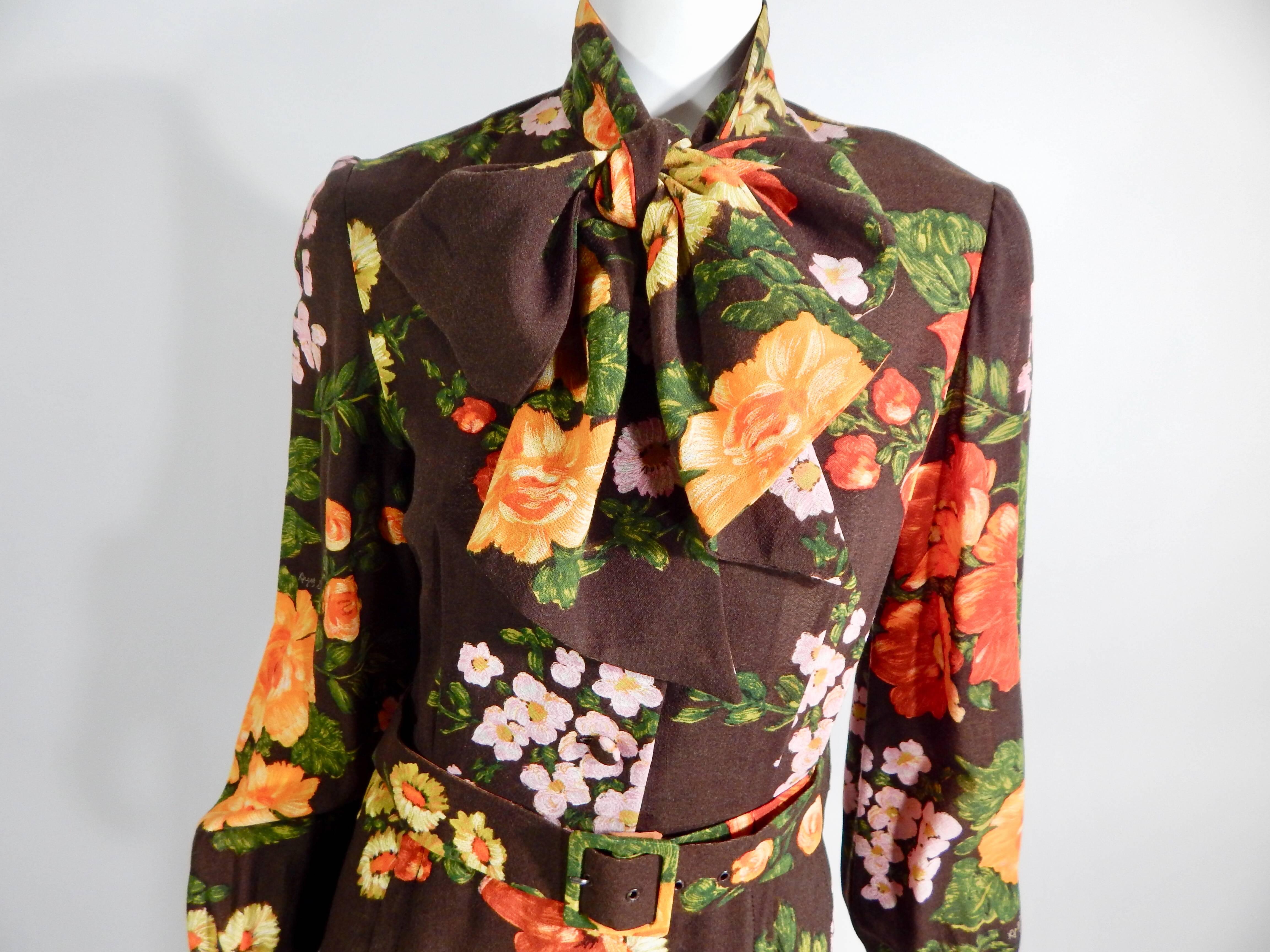 1960 Cardinals Dress. Fabulous Multicolored Floral print. Brown with pink, yellow, red, green. Attached neck bow or tie. Matching waist belt. Matching covered buttons on entire front from neck to bottom and cuffs.  Lots of attention to detail with