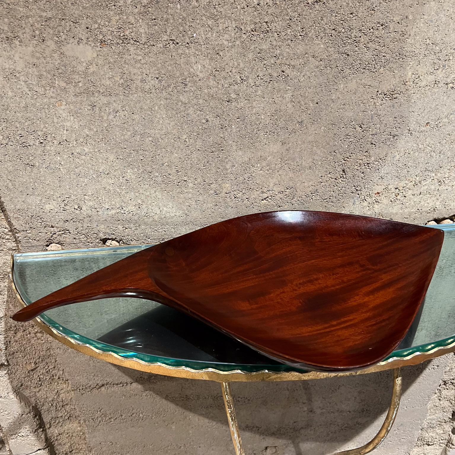 1960s Caribbean Modernism Sculptural Wood Bowl Catch All
 21 x 11.25 d x 1.5h
Stamped Caribbean Hand Craft
Preowned original vintage condition.
See images please.

