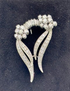 1960's Carl Bucherer 18k gold and diamond ribbon brooch