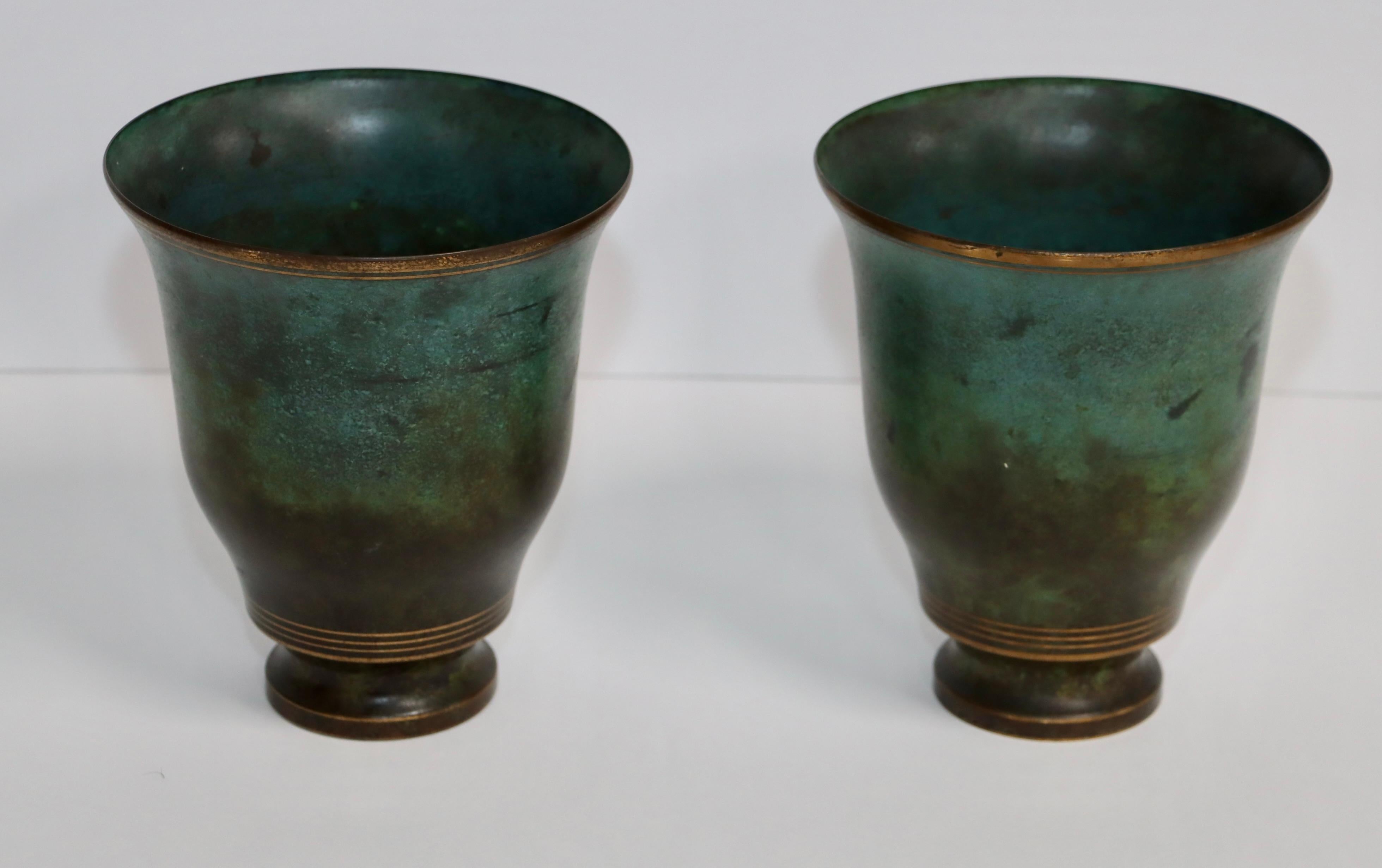 1960's mid-century modern bronze vases designed by Carl Sorensen, in vintage original condition with some wear and patina due to age and use.