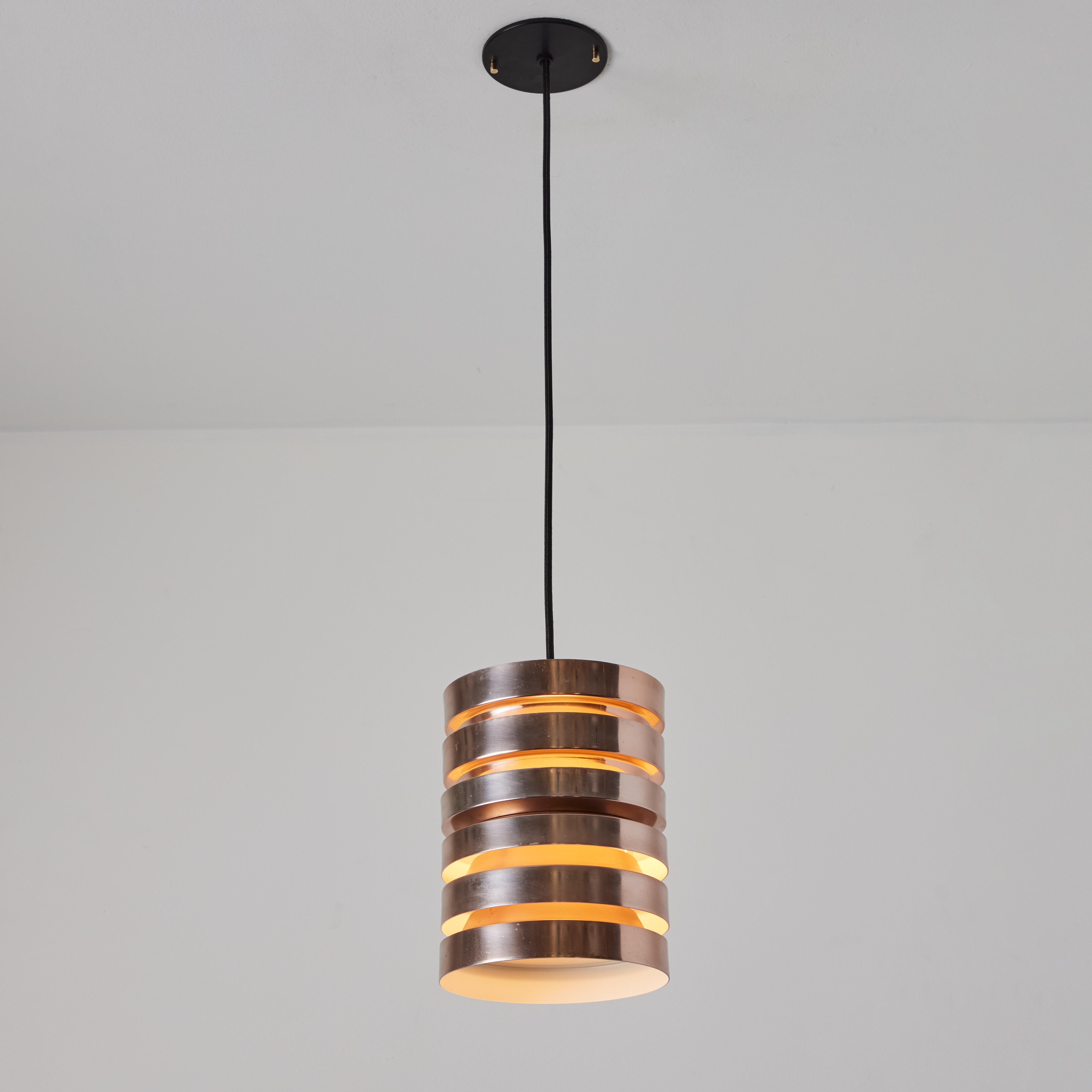 1960s Carl Thore Copper Pendant

Executed in sculptural copper with an attractive patina and white-painted interior, this pendant lamp is highly characteristic of quintessential Swedish design of the midcentury era. Unmarked.

Sigurd 'Carl Thore'