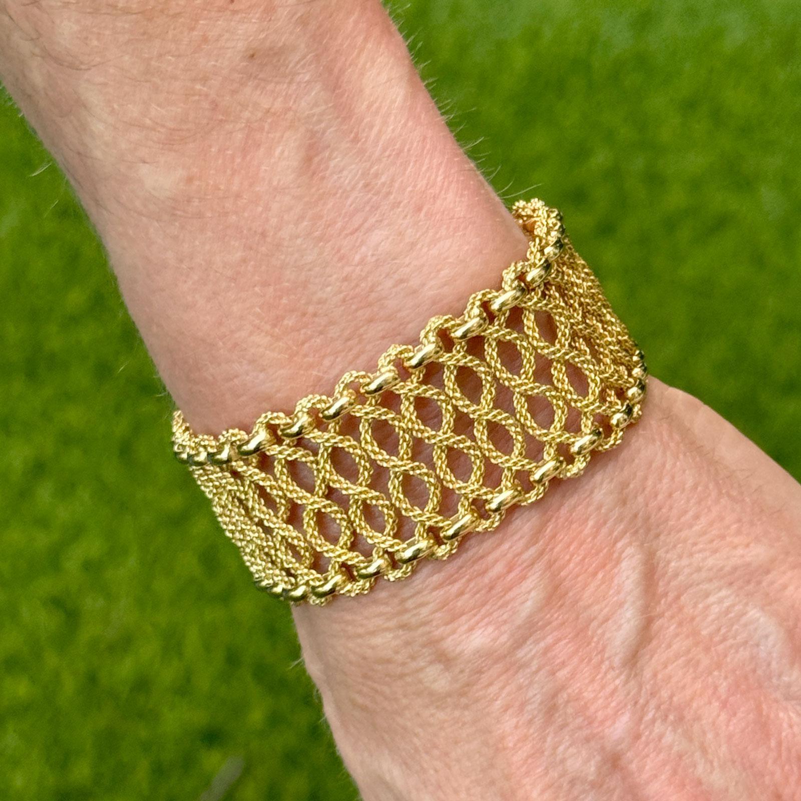 This exquisite Vintage 1960s Cartier bracelet is crafted in luxurious 18-karat yellow gold, showcasing the timeless elegance that defines Cartier’s mid-century design. Measuring 7.50 inches in length and 1.0 inch in width, this wide bracelet has a