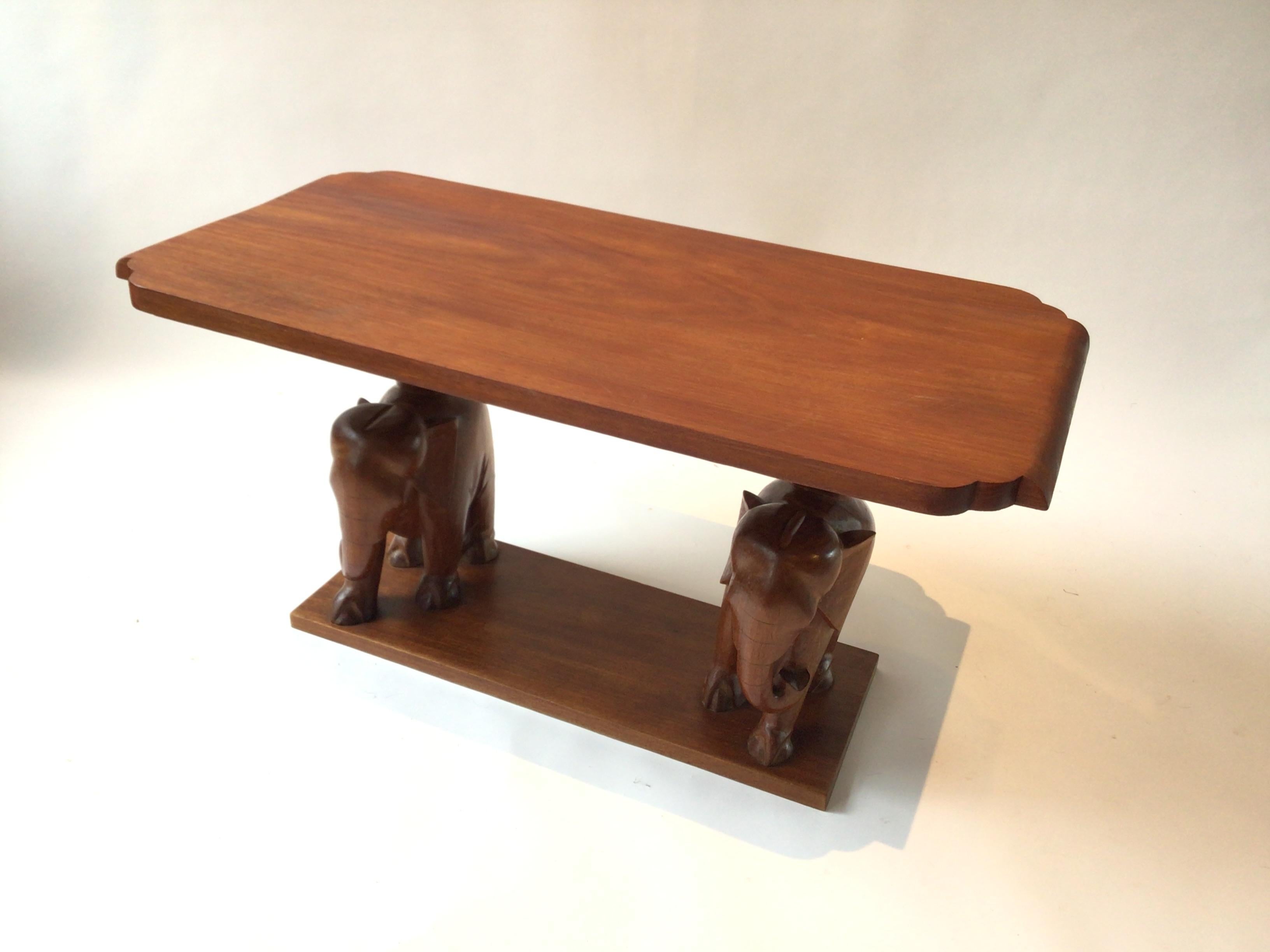 1960s Hand carved wood double elephant table. Carved in Africa.