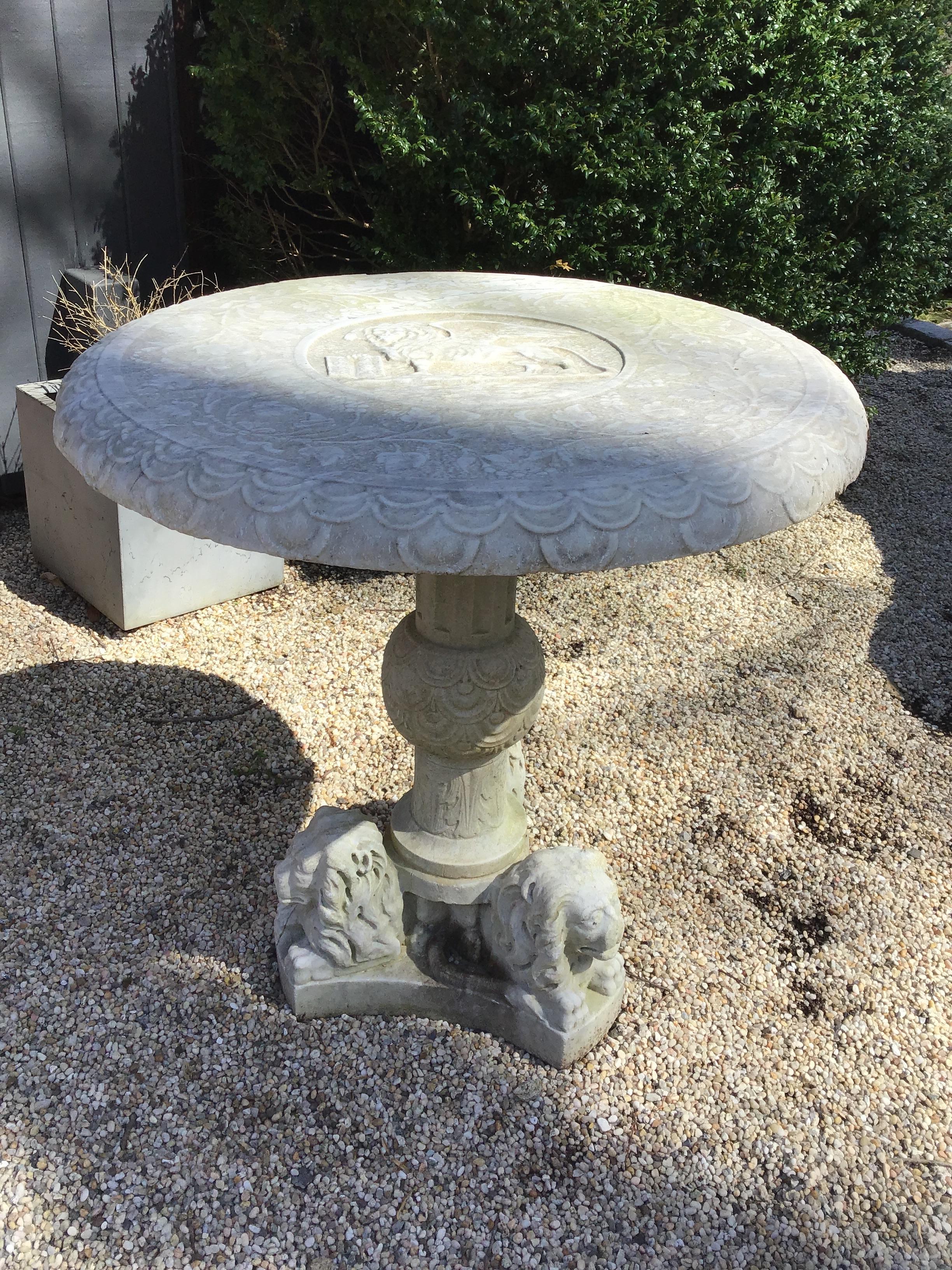 1960s carved marble lion table. Top has a griffin carved in it. Base has 3 lions on the bottom. Great for inside or out. I’m truly guessing at the age of this table, it could be older.