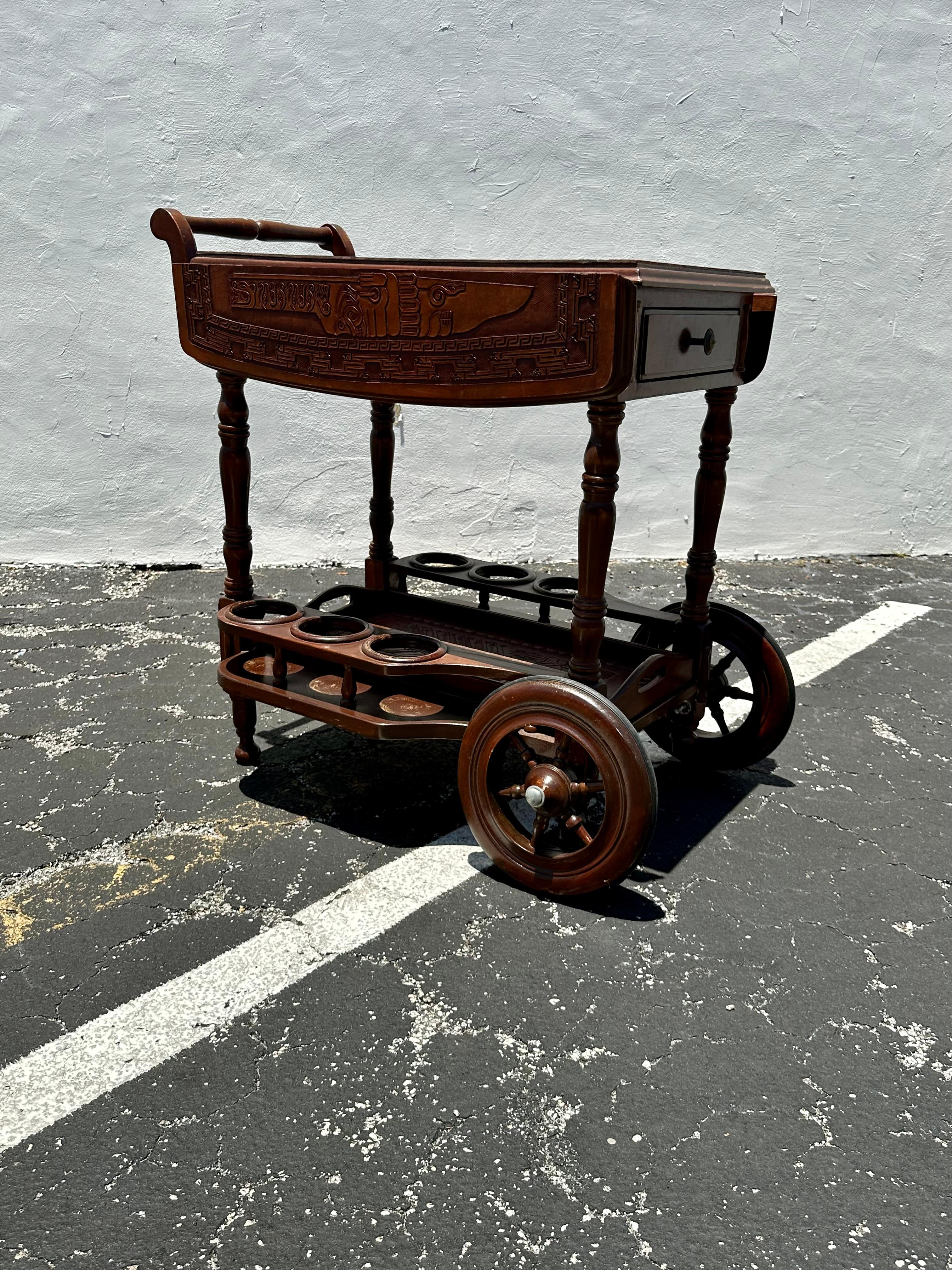 On offer on this occasion is one of the most stunning and rare, embossed leather and wood cart you could hope to find. Outstanding design is exhibited throughout. The beautiful cart is statement piece and packed with personality!! Just look at the