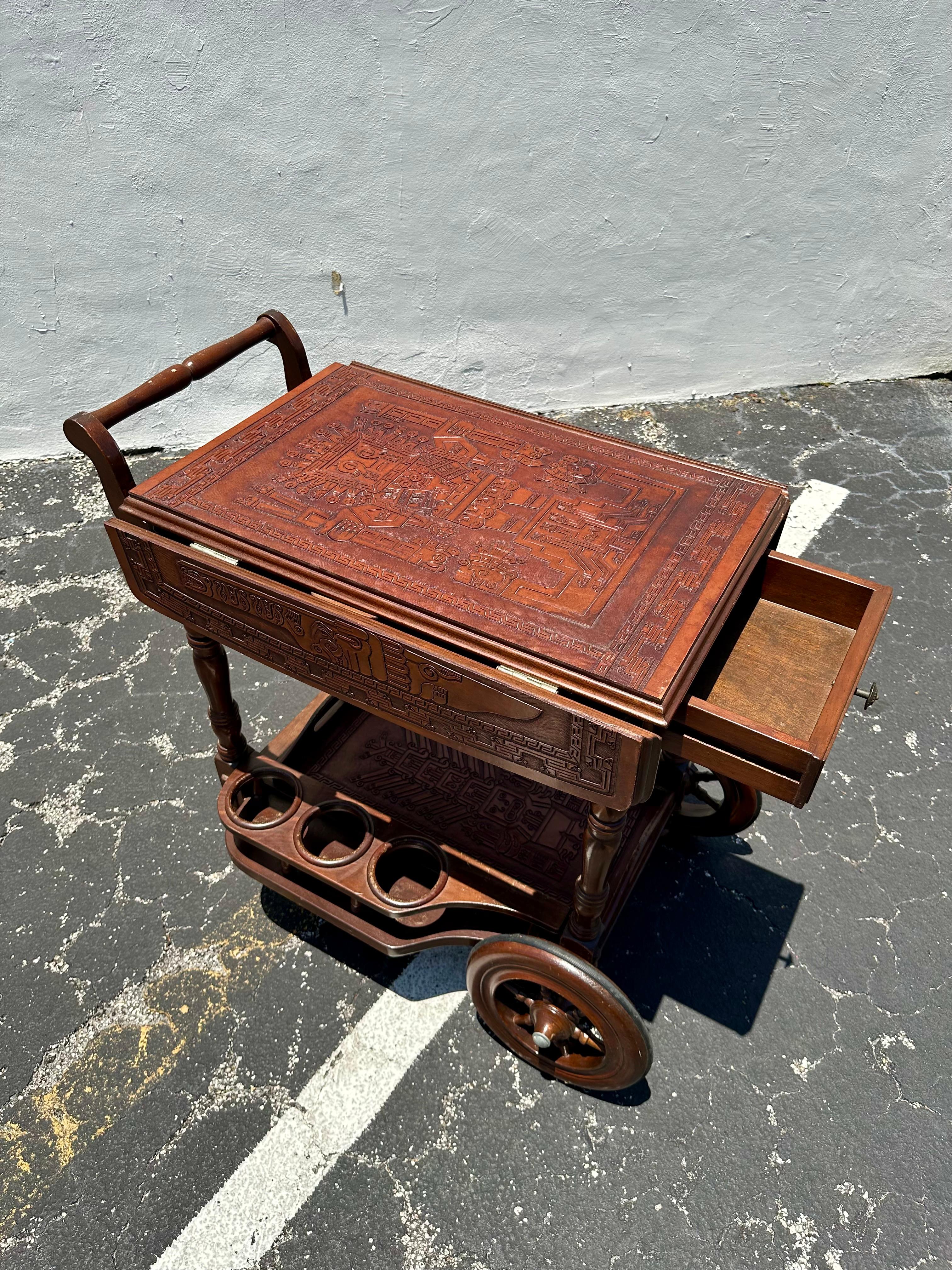 Mid-20th Century 1960s Carved Wood Leather Embossed Bar Cart Table For Sale