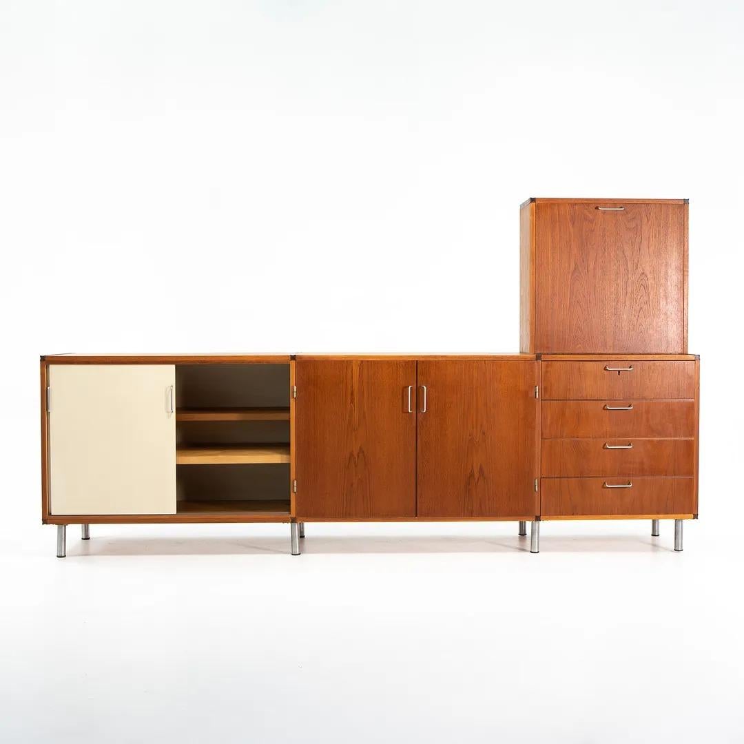 This is a modular cabinet / credenza from the Made to Measure series designed by Cees Braakman and produced by Pastoe in The Netherlands circa early 1960s. It consists of four parts; Two cupboards with sliding doors, a chest of drawers, and a