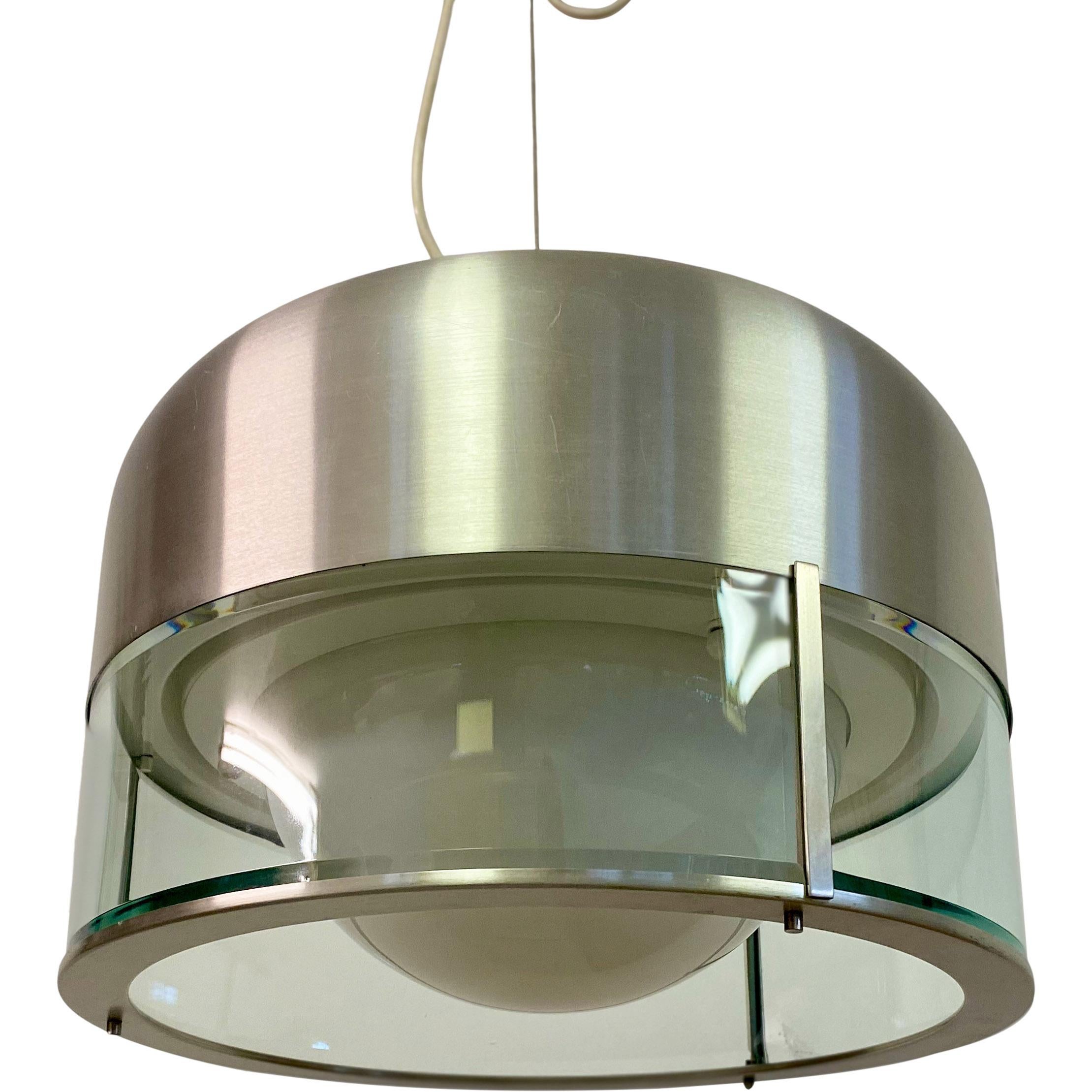 Suspension ceiling light

By Pia Guidetti Crippa 

Manufactured by Lumi

Brushed aluminium body

Glass diffuser

Labelled

Body of light measures 28cm high

Total height can be adjusted

Italy 1960s.