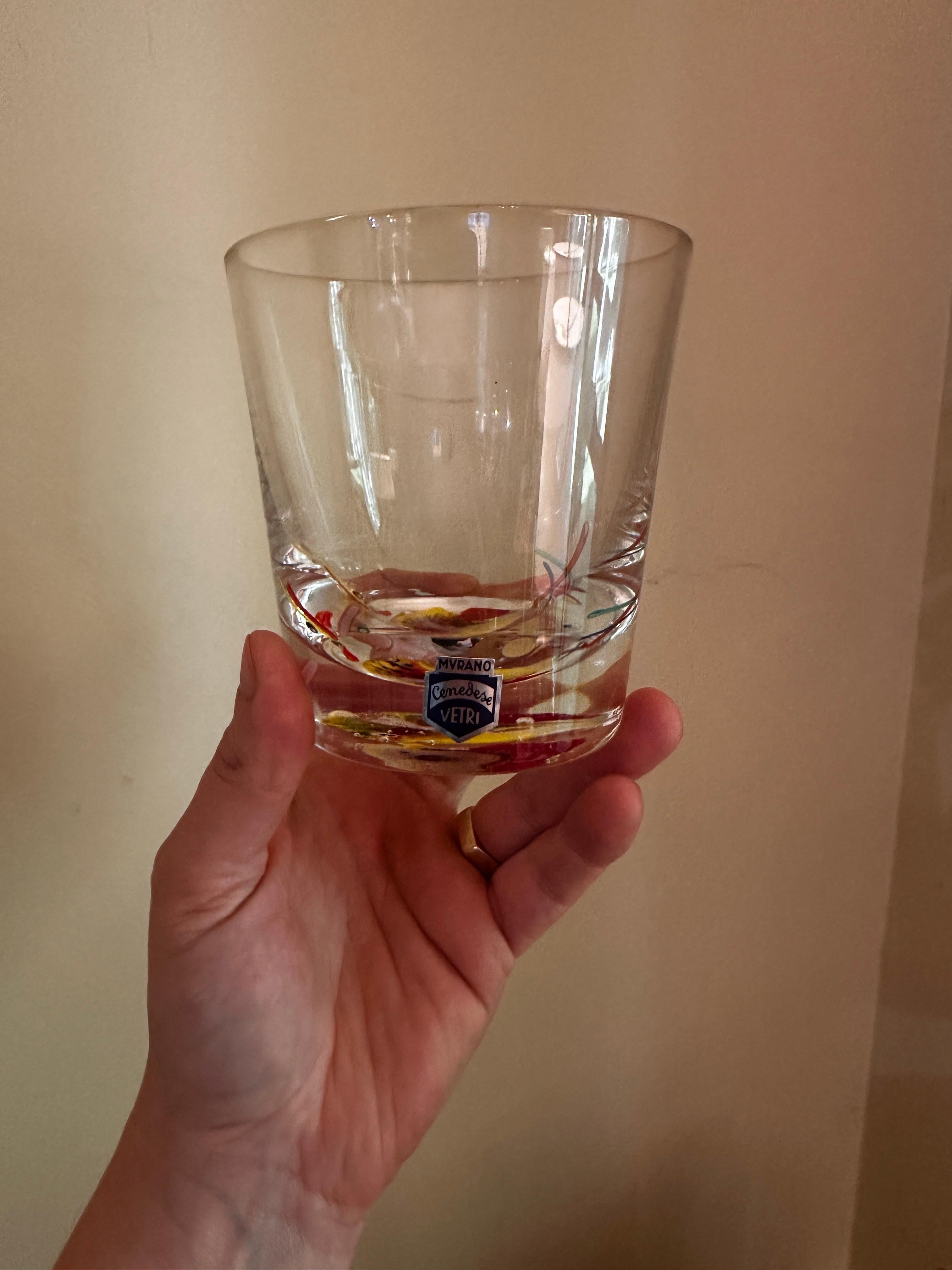 Thick hand blown art glass. Set of four, each signed on bottom and all retaining their original stickers. Large rocks glasses, measuring 4” tall, and almost 4” wide. Hefty quality feel, thick glass bottoms. 