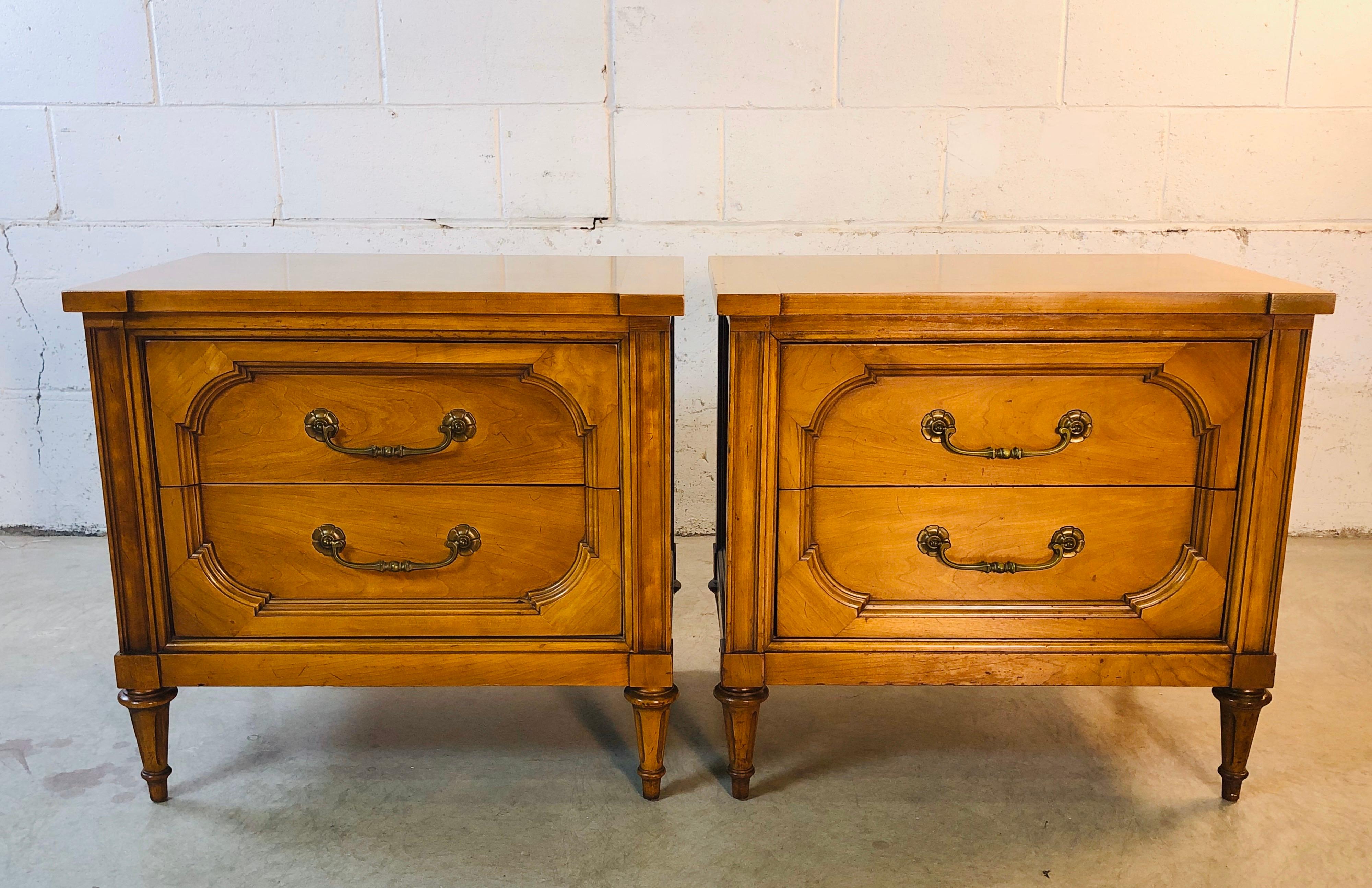 Vintage pair of nightstands by Century Furniture Co. both stands have two drawers for storage. They could also be used as end tables. They have a great grain design! They appear to be a mix of pecan and light mahogany wood. In very good used