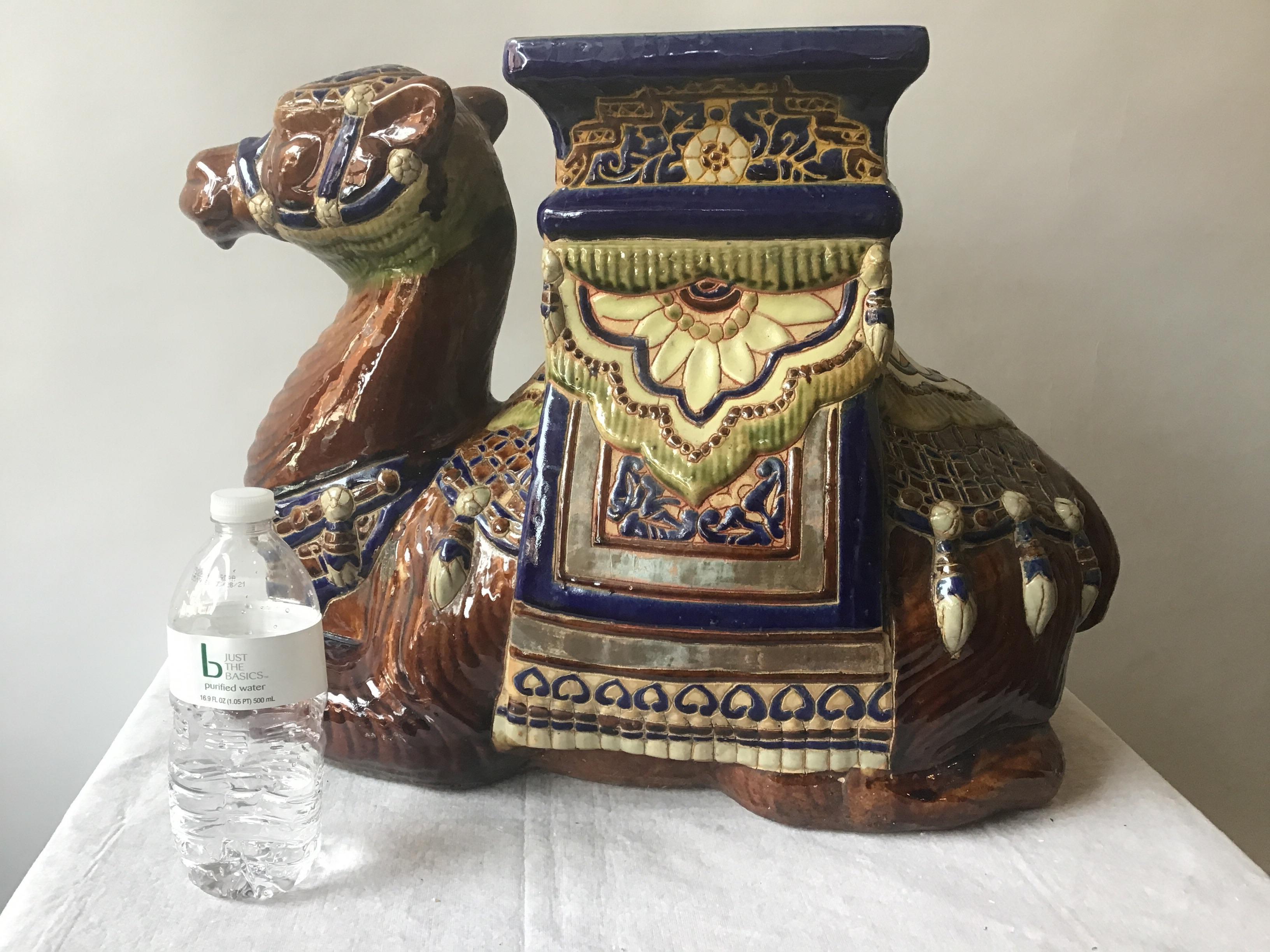 1960s ceramic camel garden seat/side table. 2 chips in finish where camel was colored in as shown in image 7 and 8.